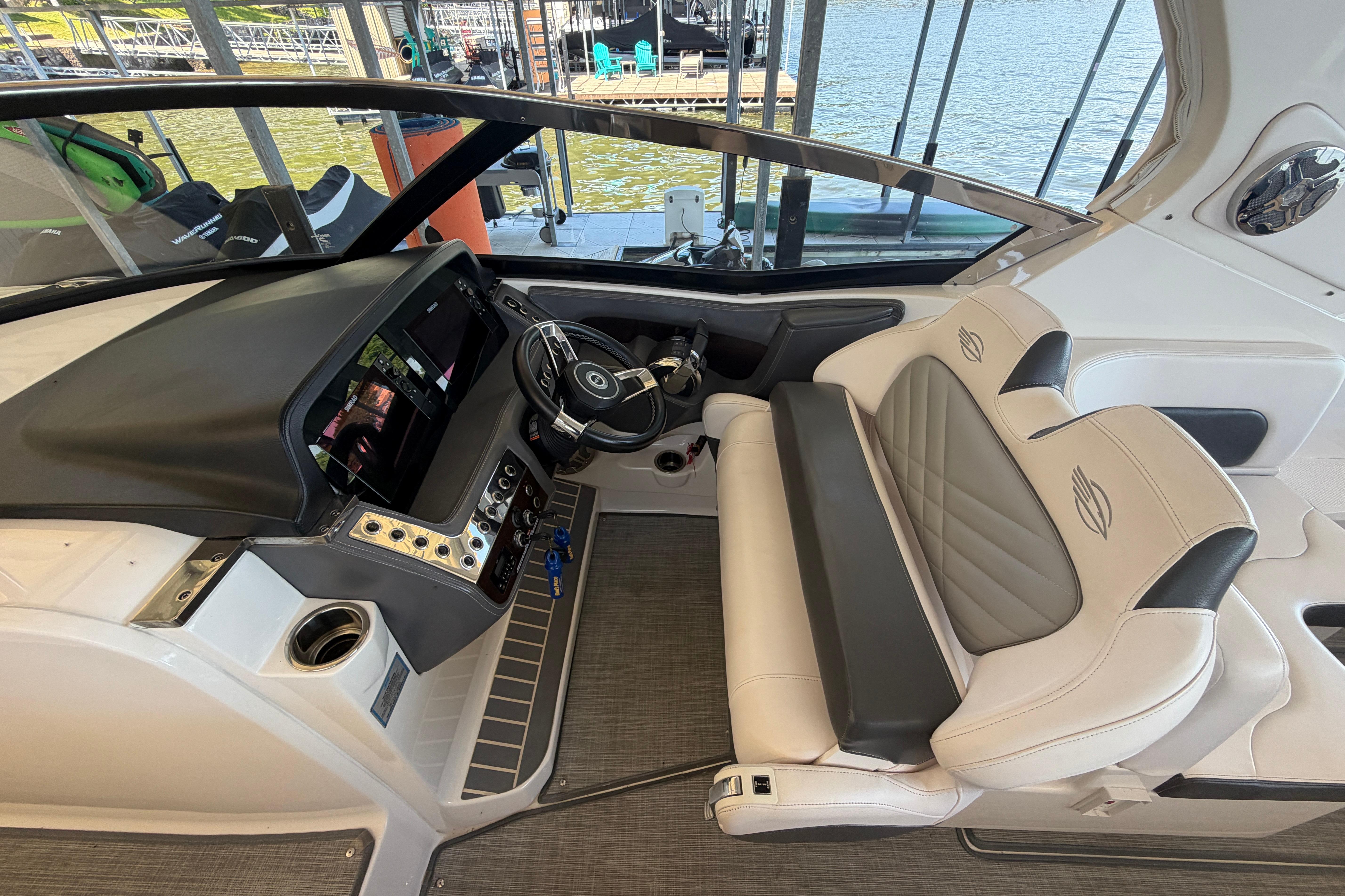 2018 Chaparral 347 SSX boat interior with modern dashboard and luxurious seating.