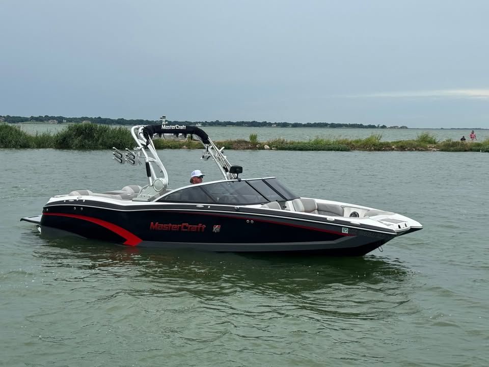 2015 MasterCraft X46 boat on calm water.