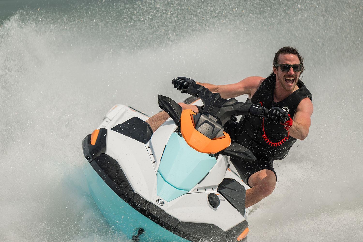 Manufacturer Provided Image: Man riding 2026 Yamaha WaveRunner JetBlaster LTD on water, creating splashes.