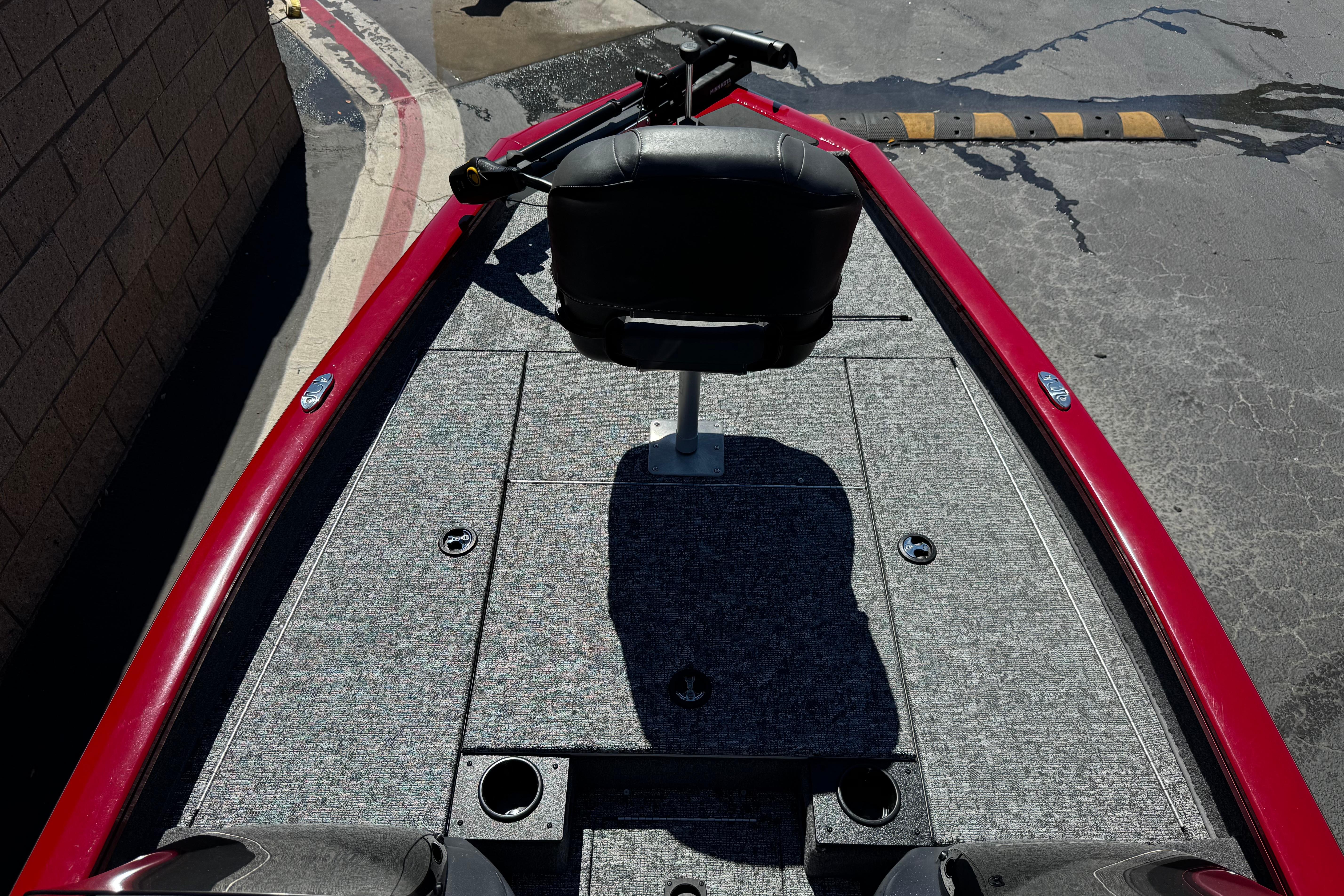 2025 Tracker Pro Team 175 TXW boat deck with red trim and seating.