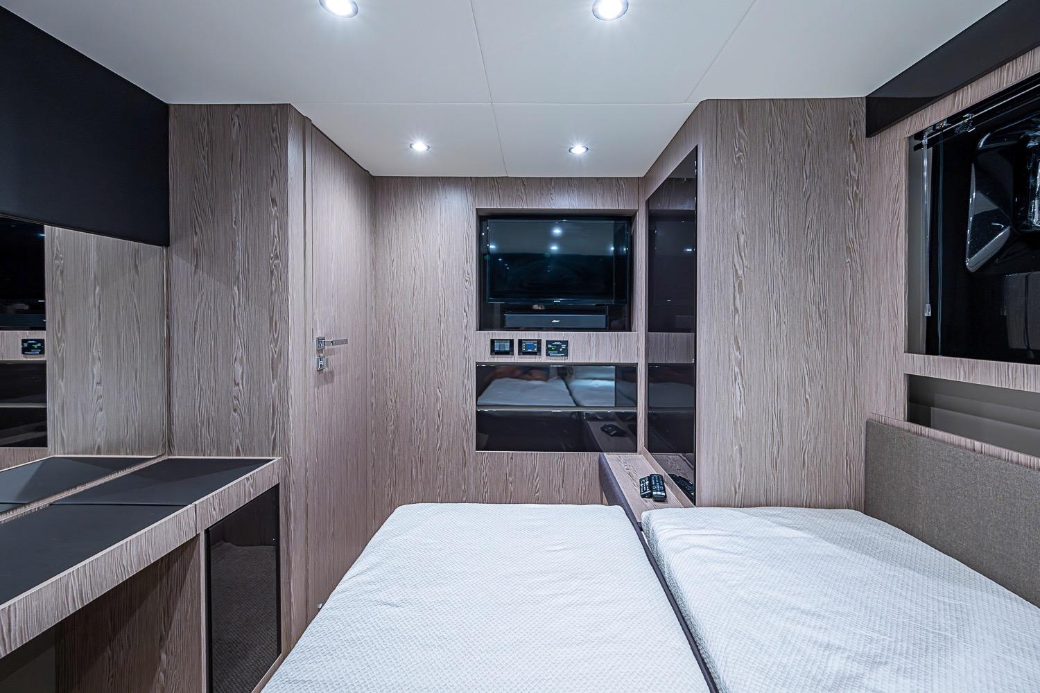 Luxurious interior cabin of 2019 Azimut Atlantis 51 yacht with modern wood finish.