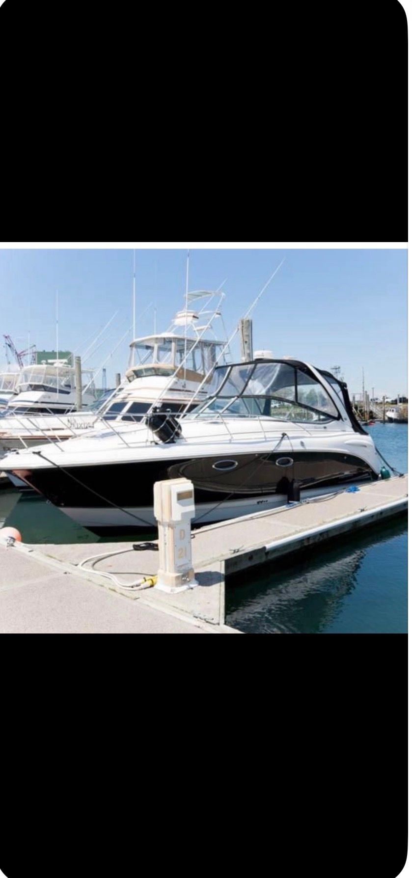 2006 Chaparral Signature 310 yacht docked at marina.