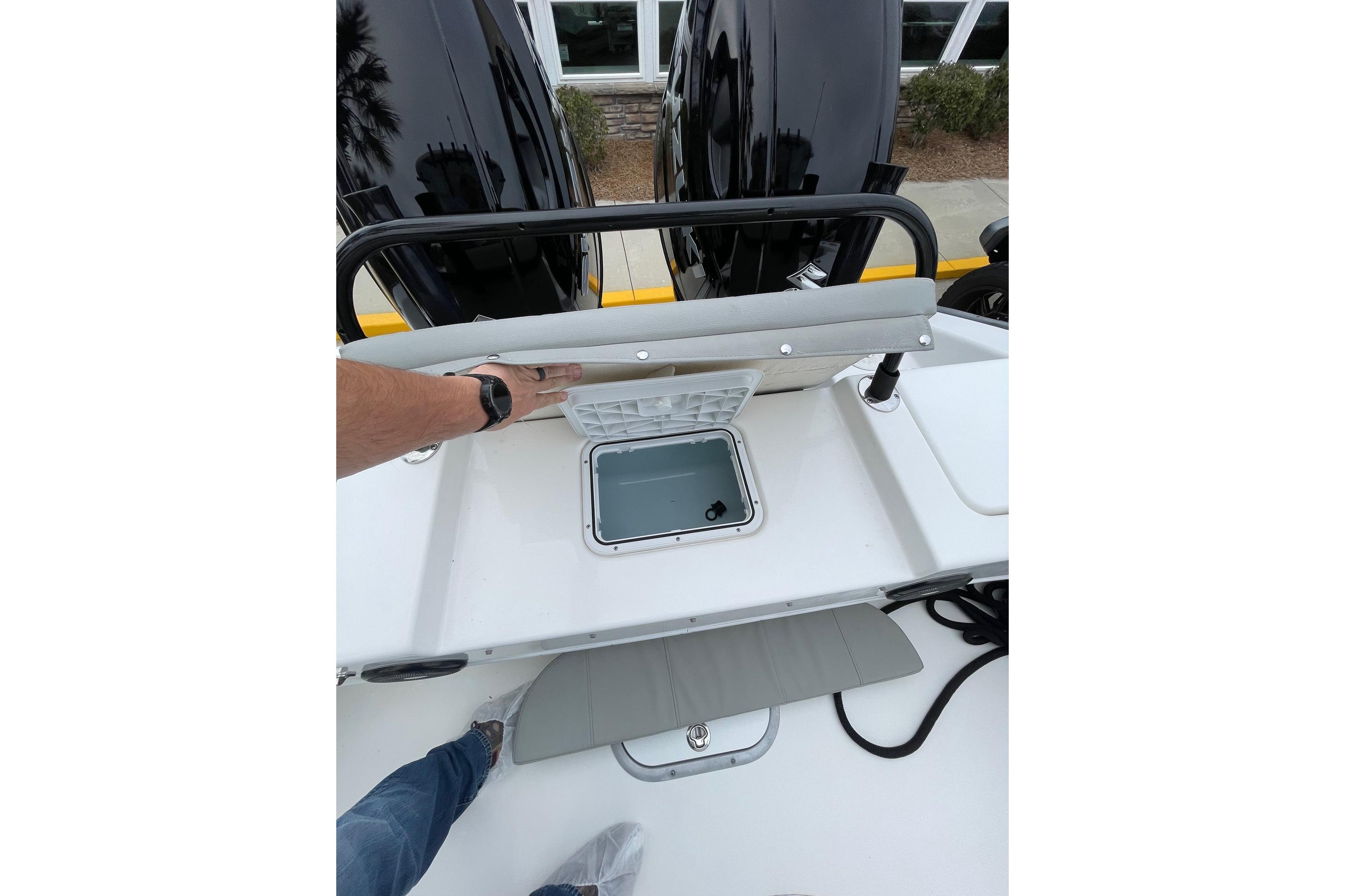 2023 Cape Horn 24 XS boat interior with storage compartment and dual engines.