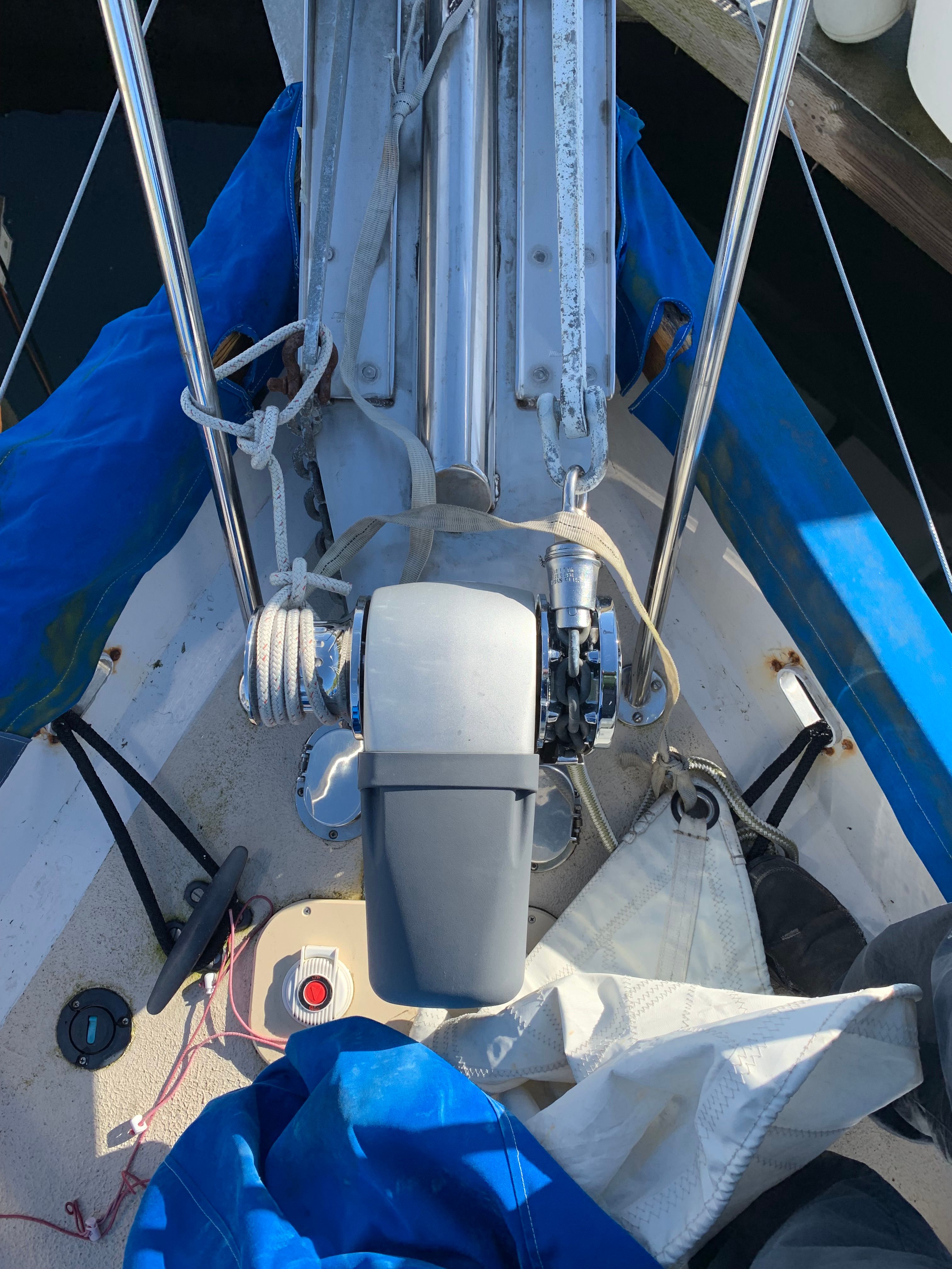 Boat deck with sailing equipment and motor, Custom 341, year 1994.