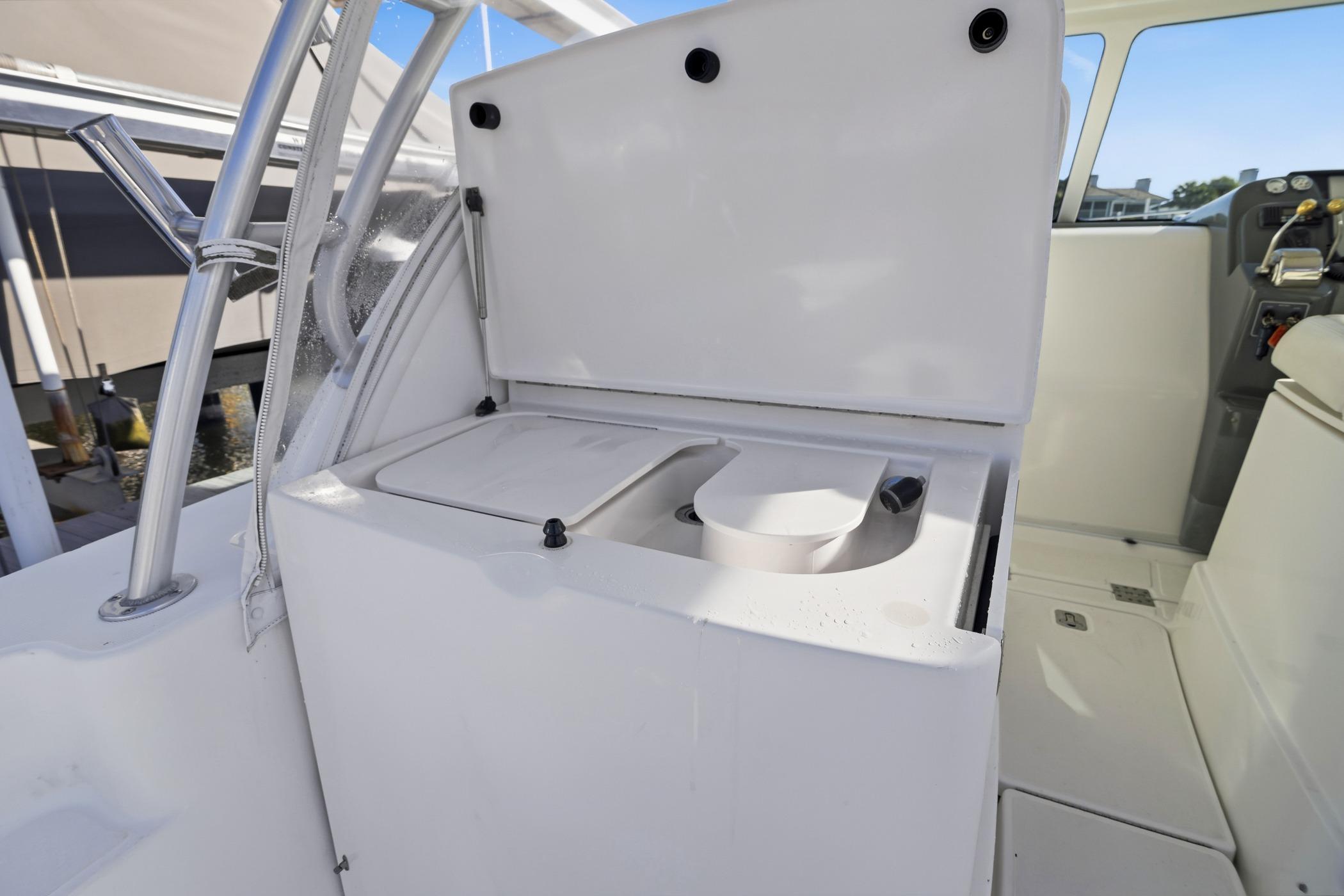 2007 Tiara Yachts 3000 Open boat interior with open storage compartment.