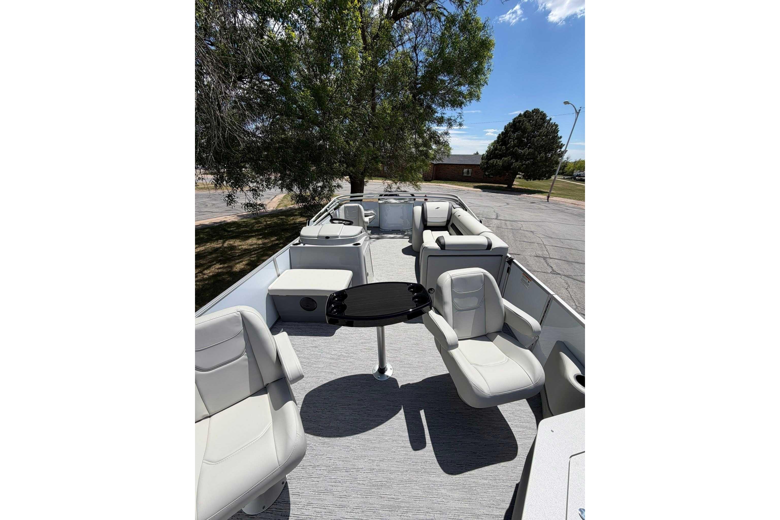 2026 Starcraft EX 22 FD4 pontoon boat interior with seating and table.
