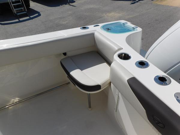 2024 Sailfish 242 CC boat interior with seating and cup holders.