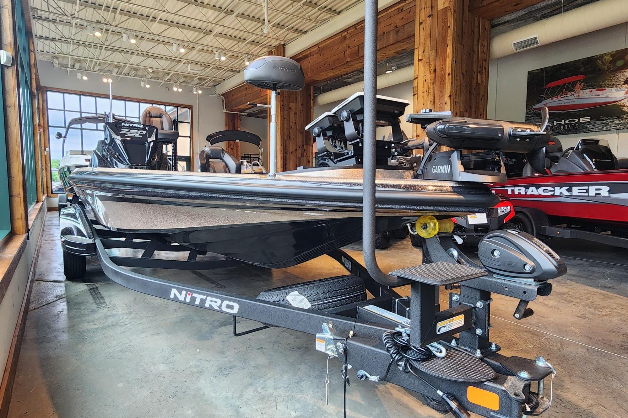 2026 Nitro Z20 XL boat displayed in a showroom with modern features.
