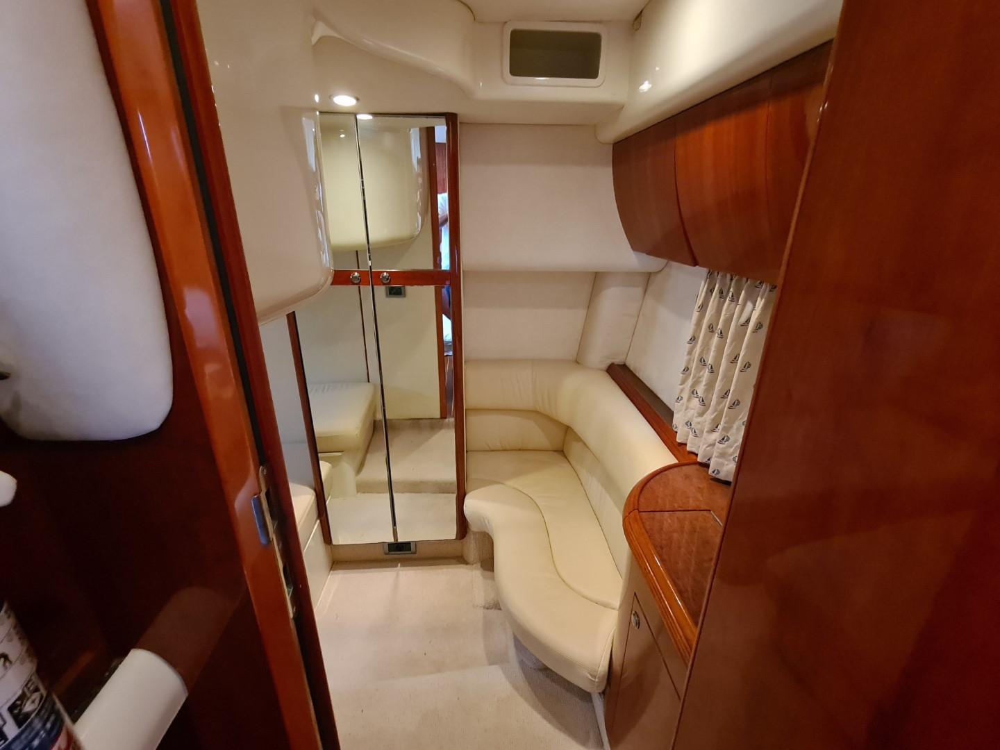 Luxurious interior of 2004 Fairline Targa 43 yacht with elegant wood finishes.