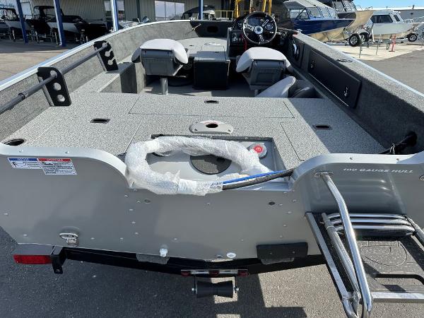 2024 Starweld 16 Fusion SC Pro fishing boat interior with seating and steering console.