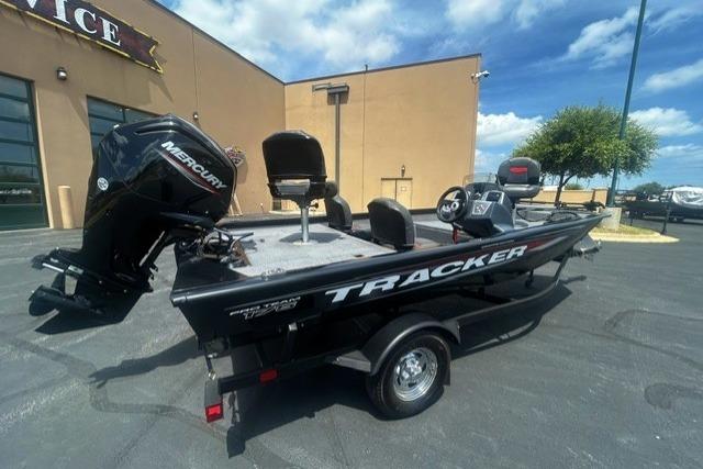 2026 Tracker Pro Team 175 Crappie Edition boat with Mercury engine, parked outdoors.