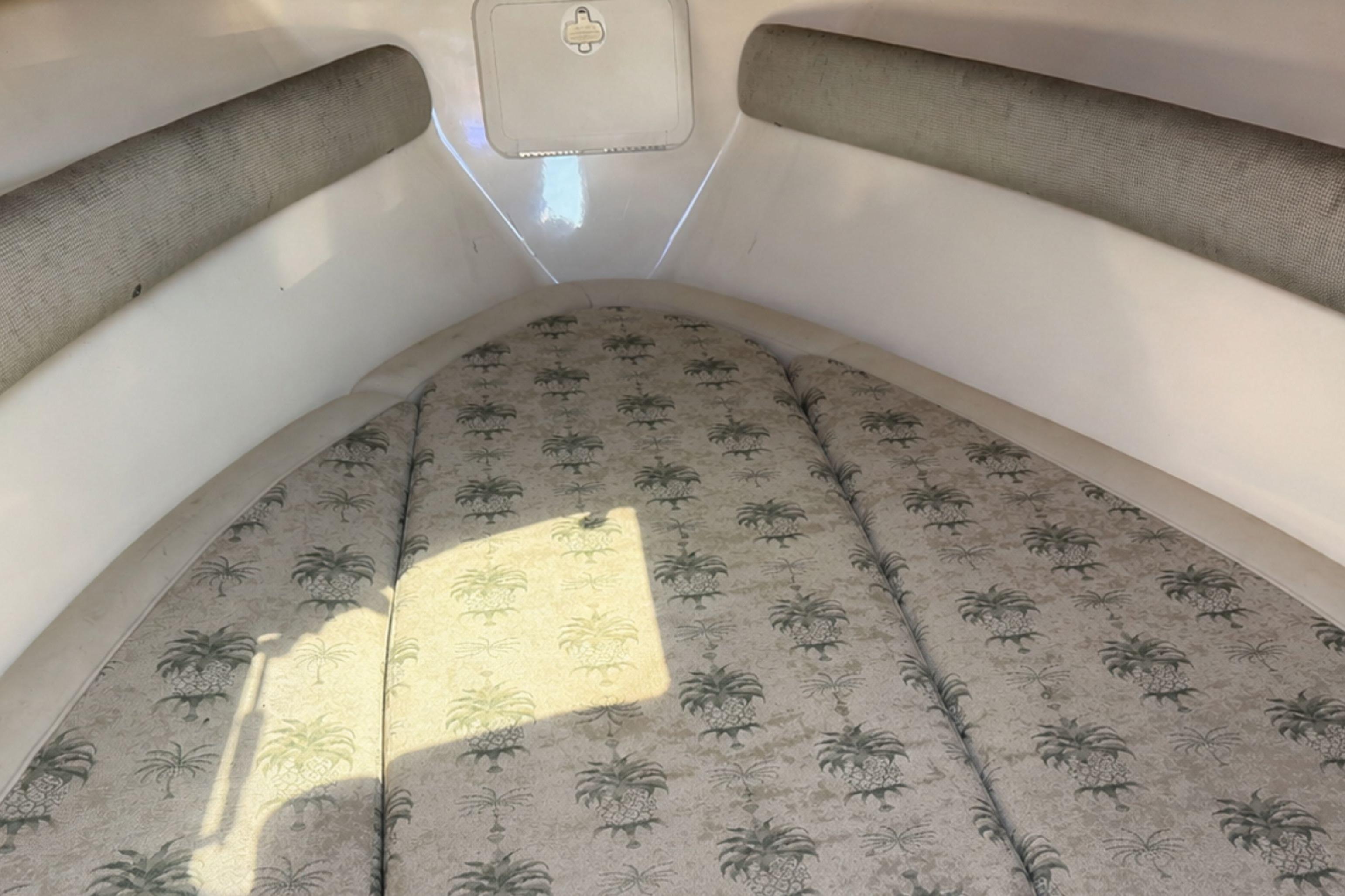 Interior cabin of 2008 Scout 222 Abaco boat with patterned cushions.