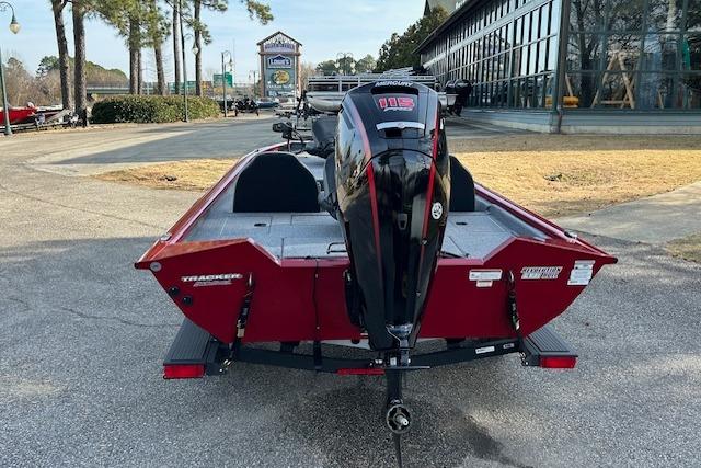 2025 Tracker Pro Team 190 boat with powerful outboard motor, parked outdoors.