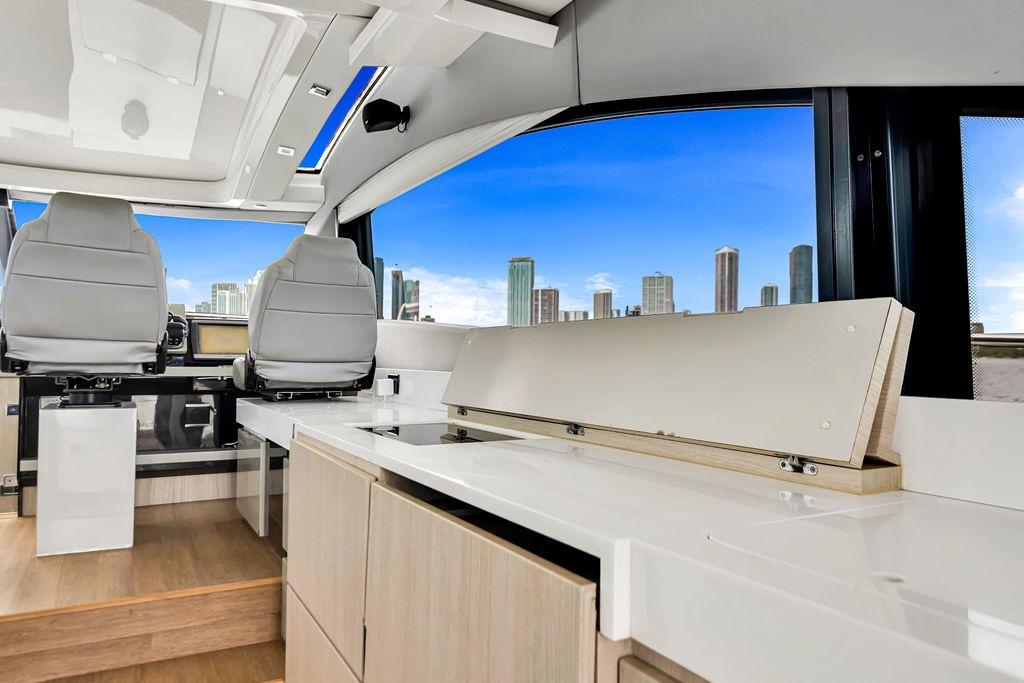 Interior of 2012 Fairline Targa 58 yacht with modern seating and city skyline view.