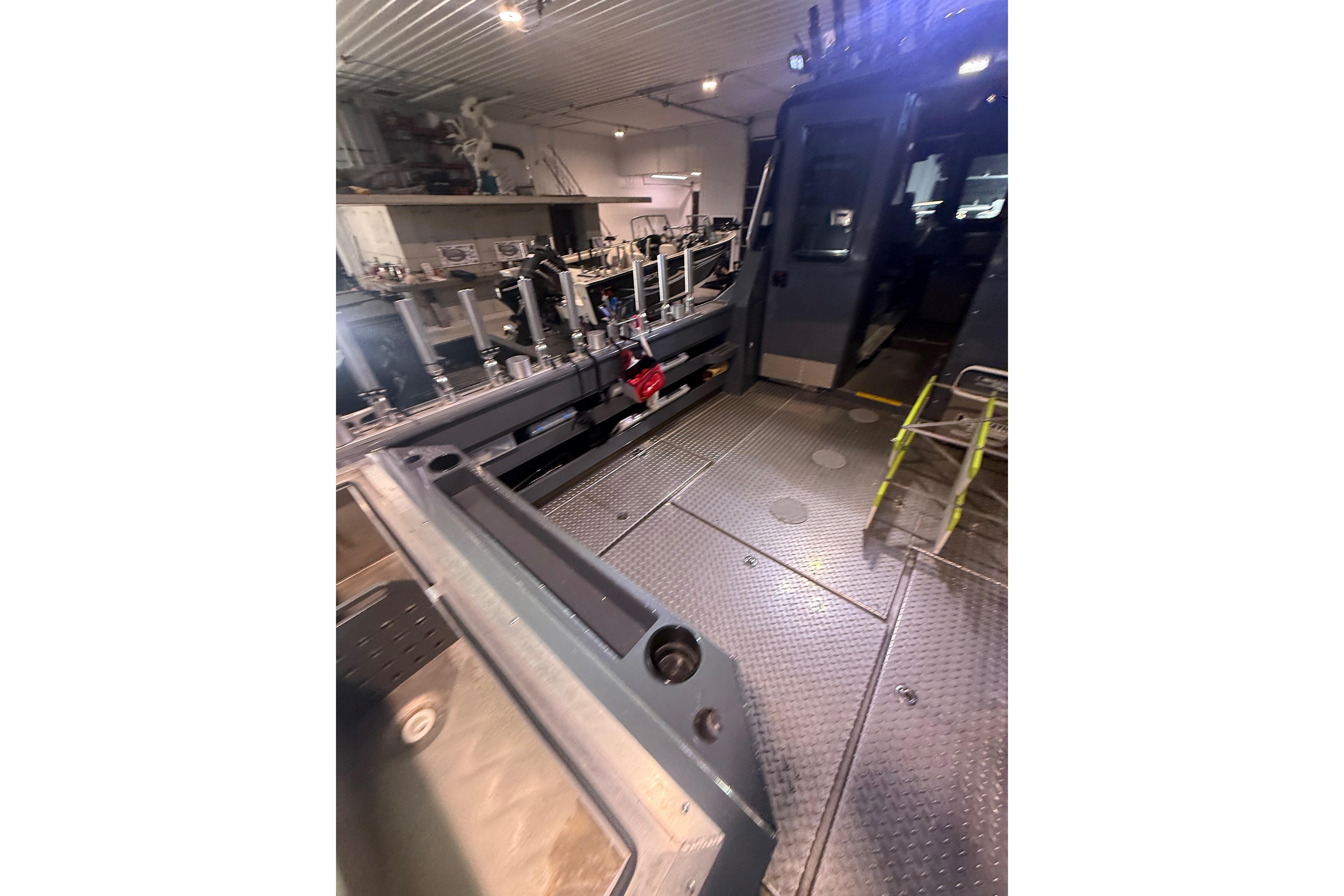 Interior of 2022 Hewescraft 270 Alaskan Hardtop, showcasing spacious deck and modern equipment.