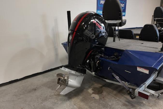 2024 Lowe Stinger 198 boat with powerful outboard motor in showroom.