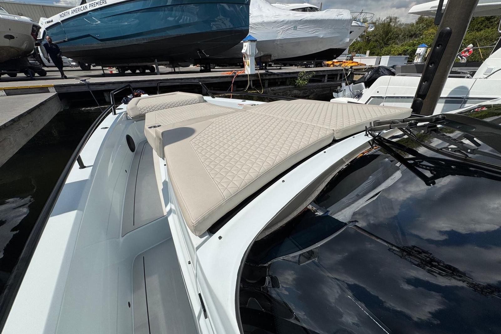 2023 BRABUS Shadow 900 ST luxury yacht with beige quilted sunbed on deck.