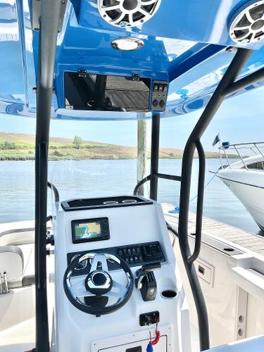 2025 Starcraft SVX 211 OB CC boat interior with modern controls and steering wheel.