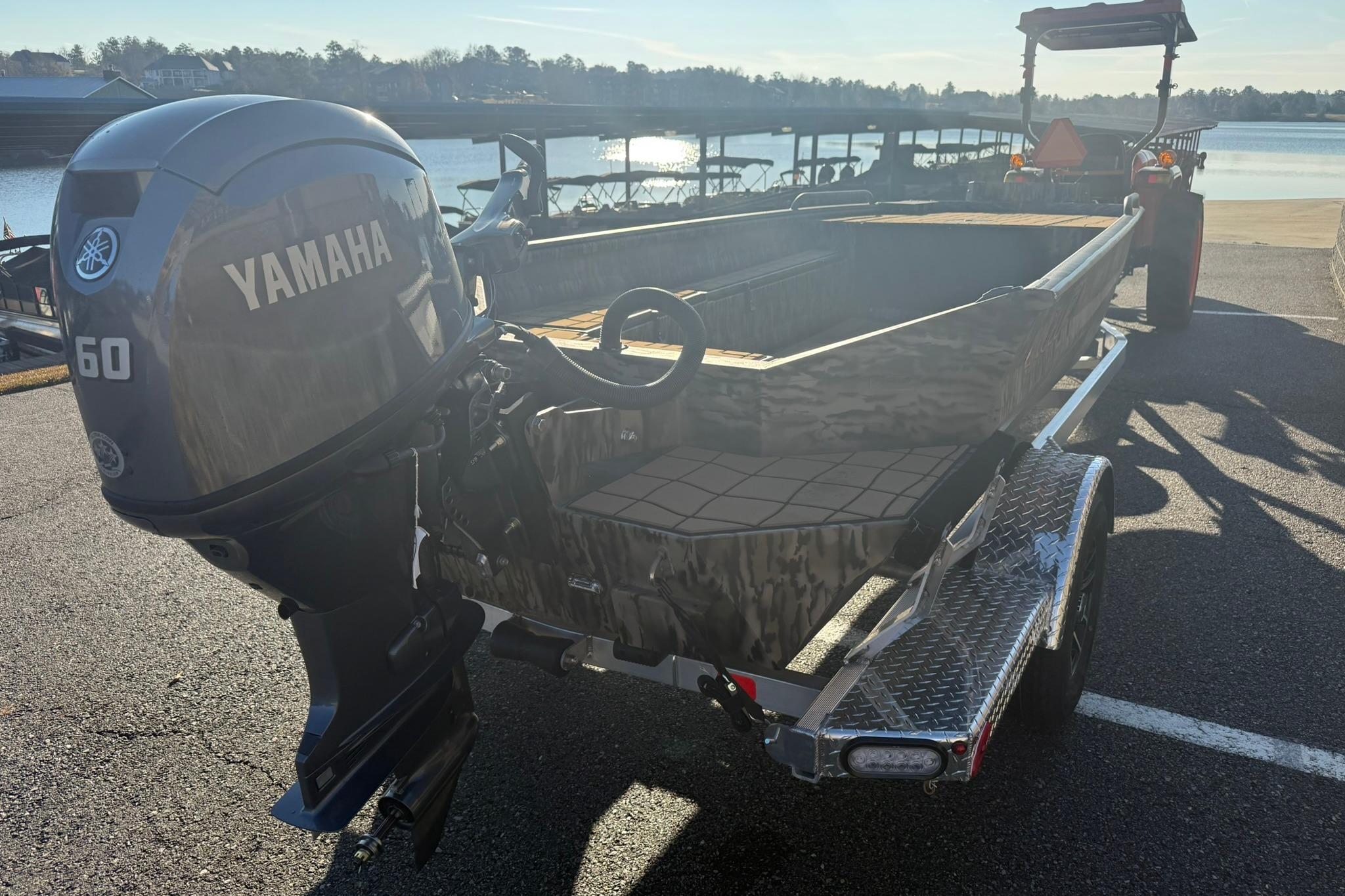 2026 Excel 1751 Shallow Water F4 boat with Yamaha 60 engine at lakeside.