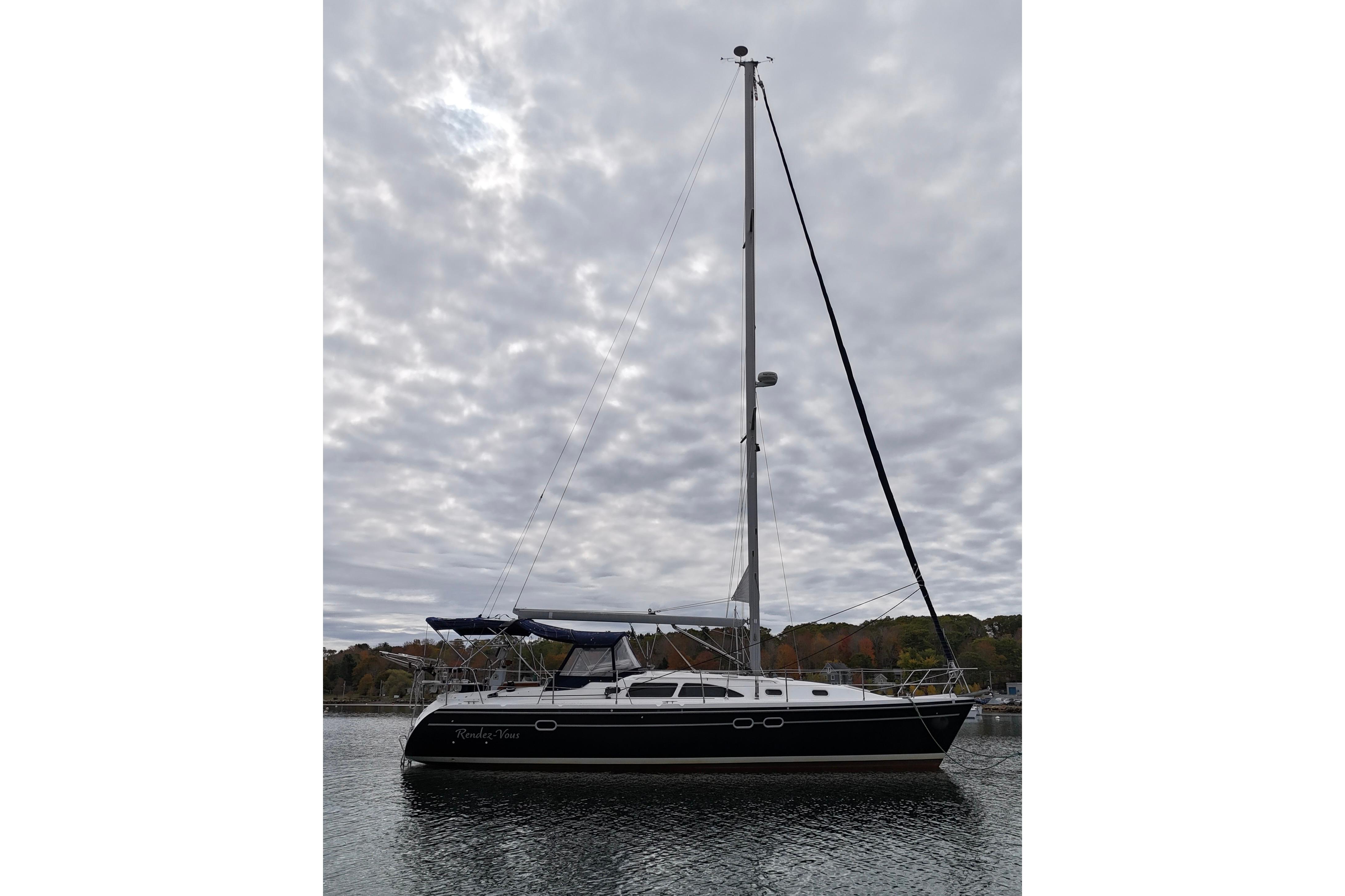 Sailboat Catalina 387, 2003 model, docked under cloudy sky.