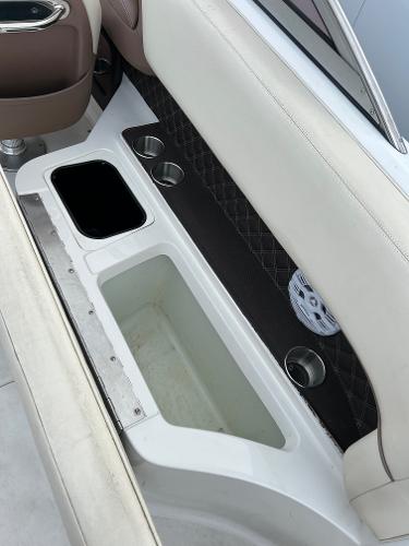 Interior of 2010 Cobalt 262 boat with cup holders and storage compartments.