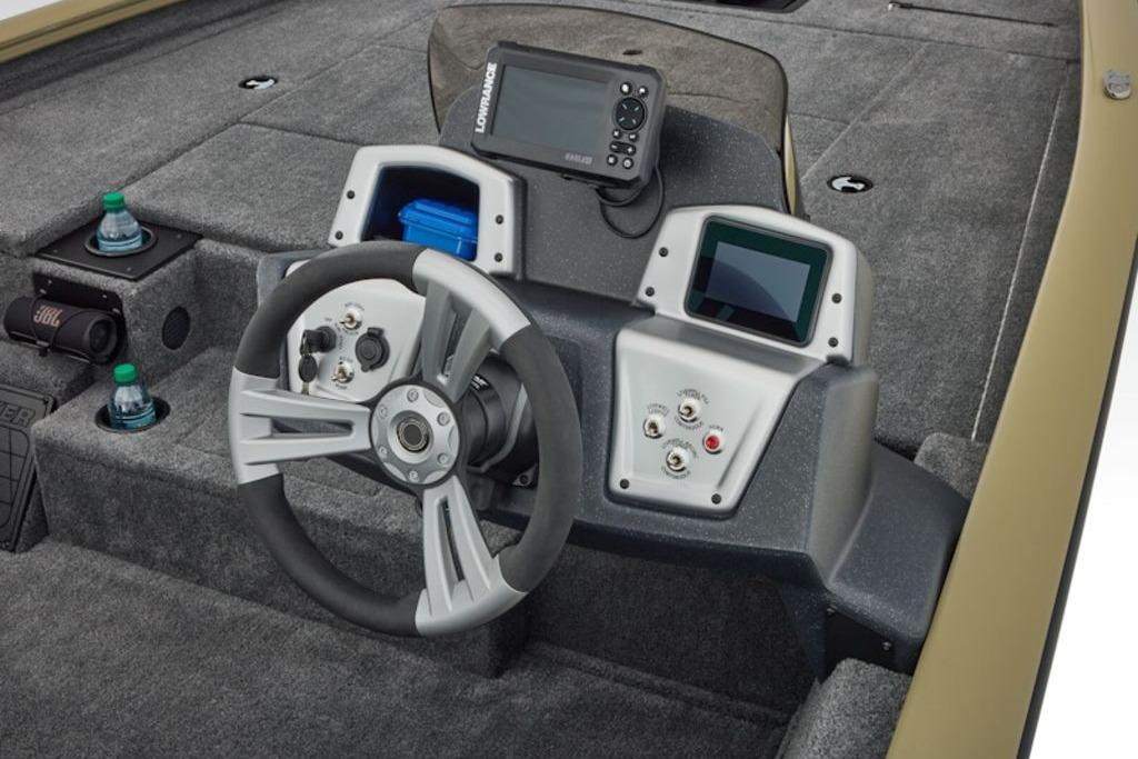 2026 Tracker Pro Team 195 boat dashboard with steering wheel and electronic displays.