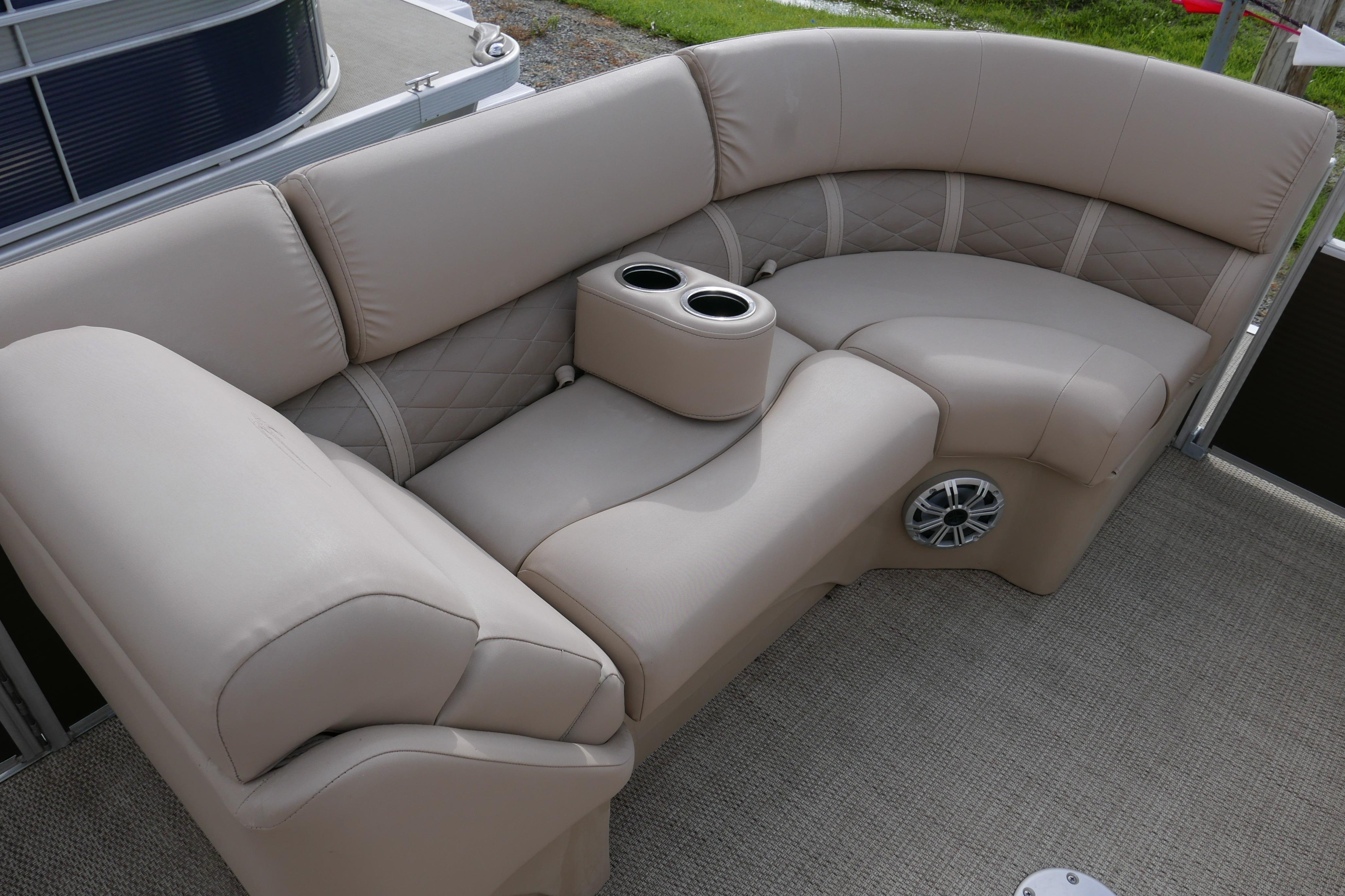 Luxurious seating on 2018 Bennington 22 SSRX pontoon boat with cup holders and speaker.