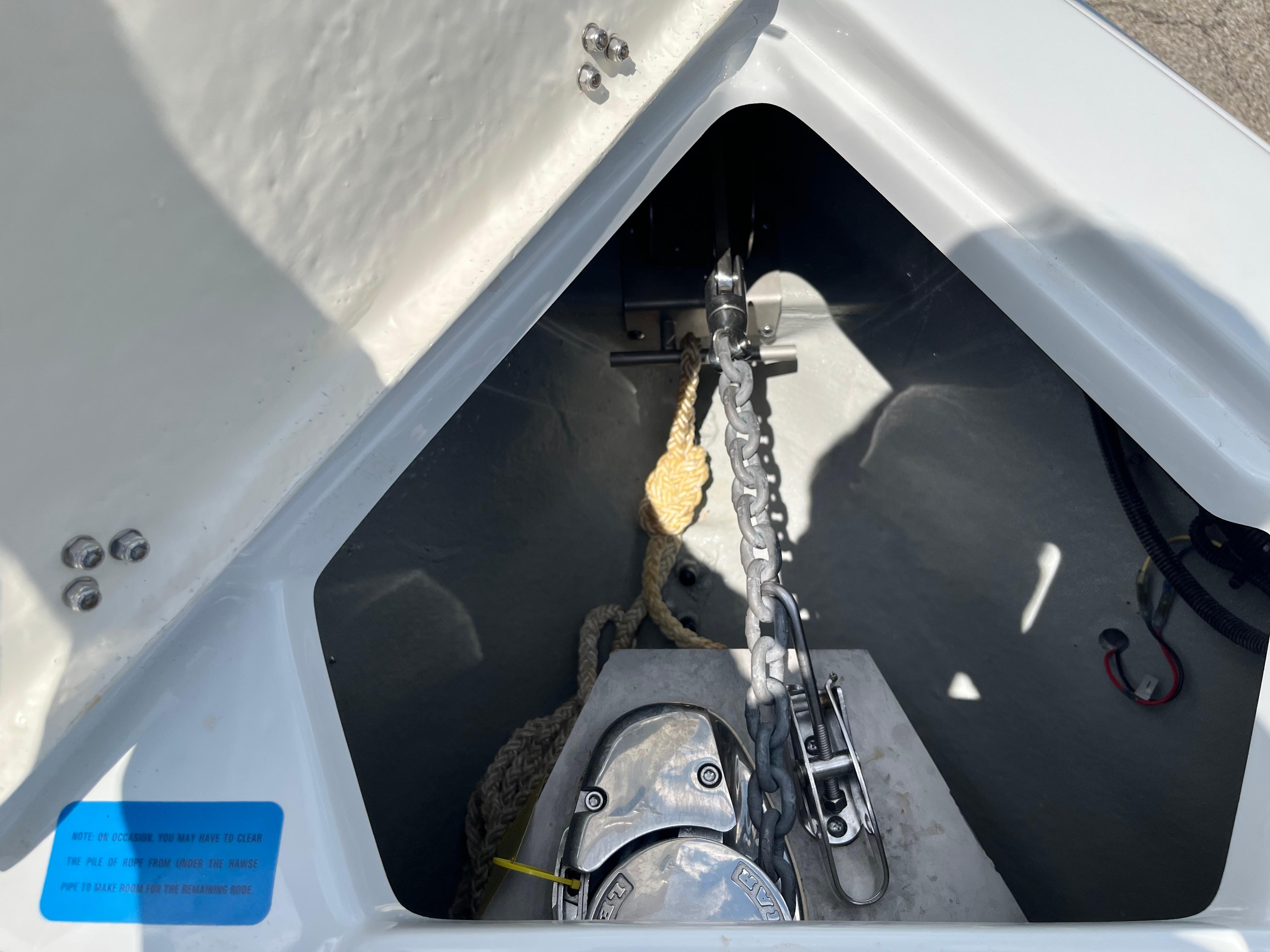 Anchor compartment of 2022 Crownline 280 SS boat with chain and rope.