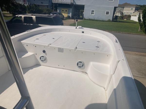 2011 Carolina Skiff 258 DLV boat deck, white interior, residential background.