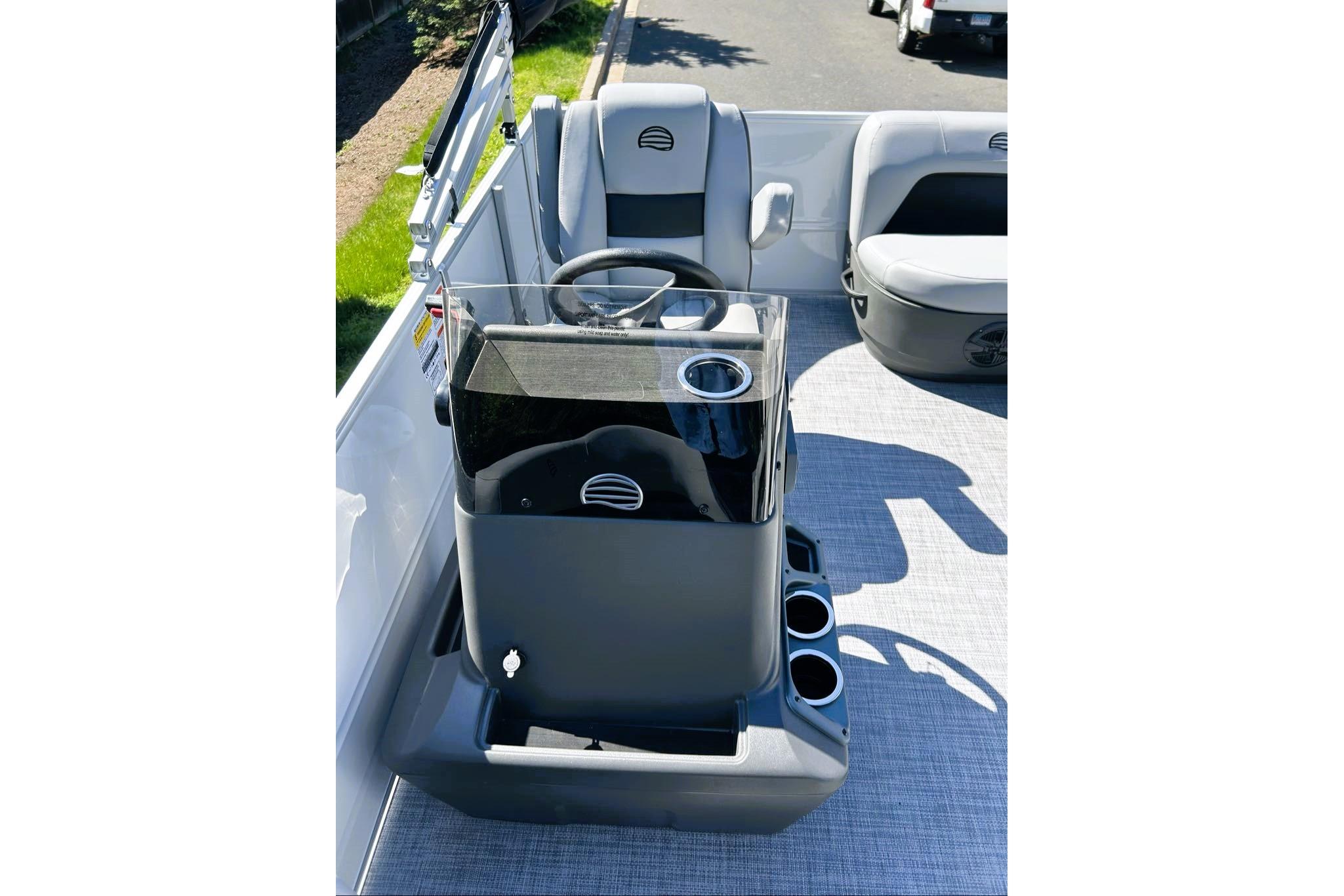 2026 Sun Tracker Party Barge 16 DLX interior with steering console and seating.