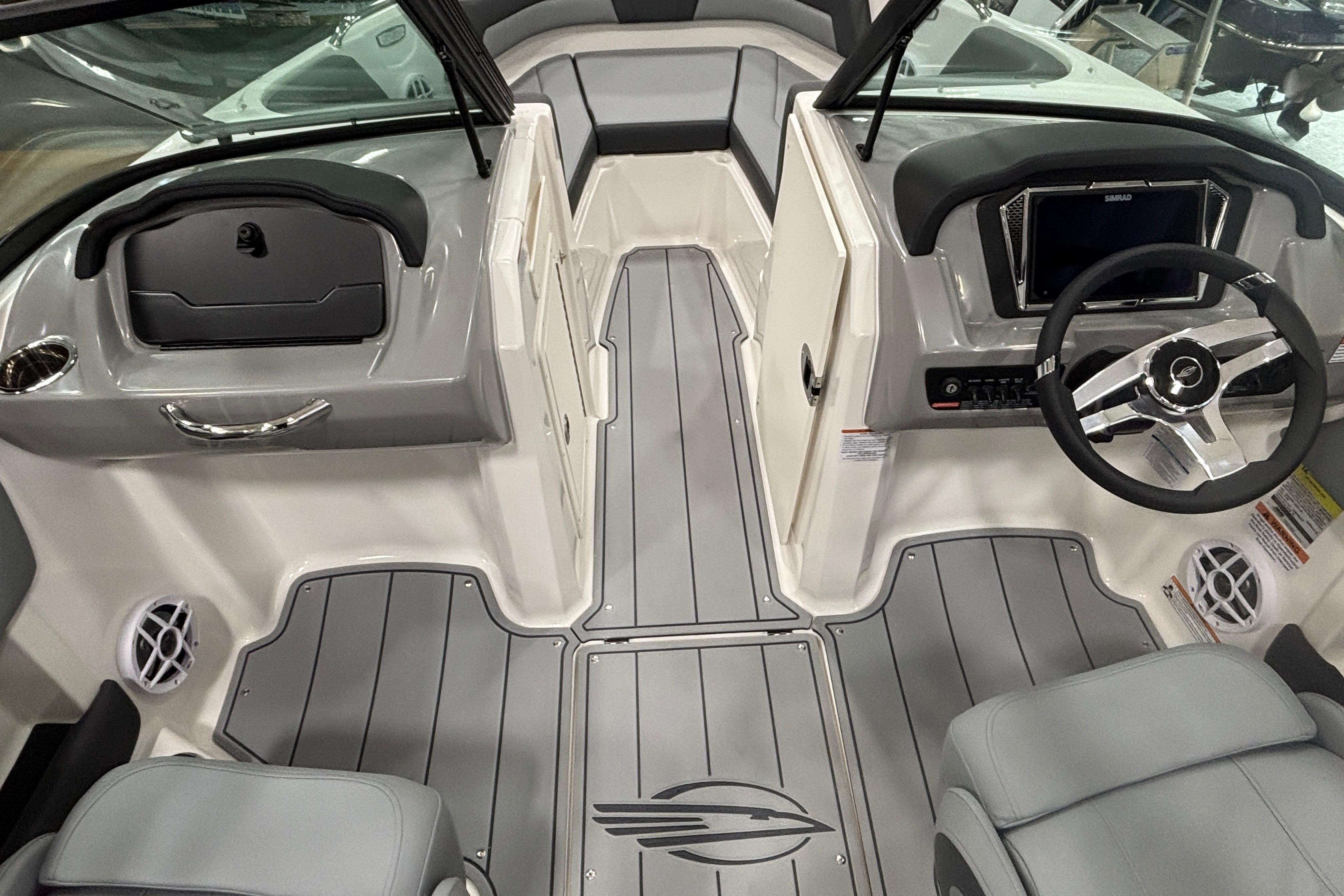 Interior of 2026 Chaparral 21 SSi with gray seating and steering wheel.