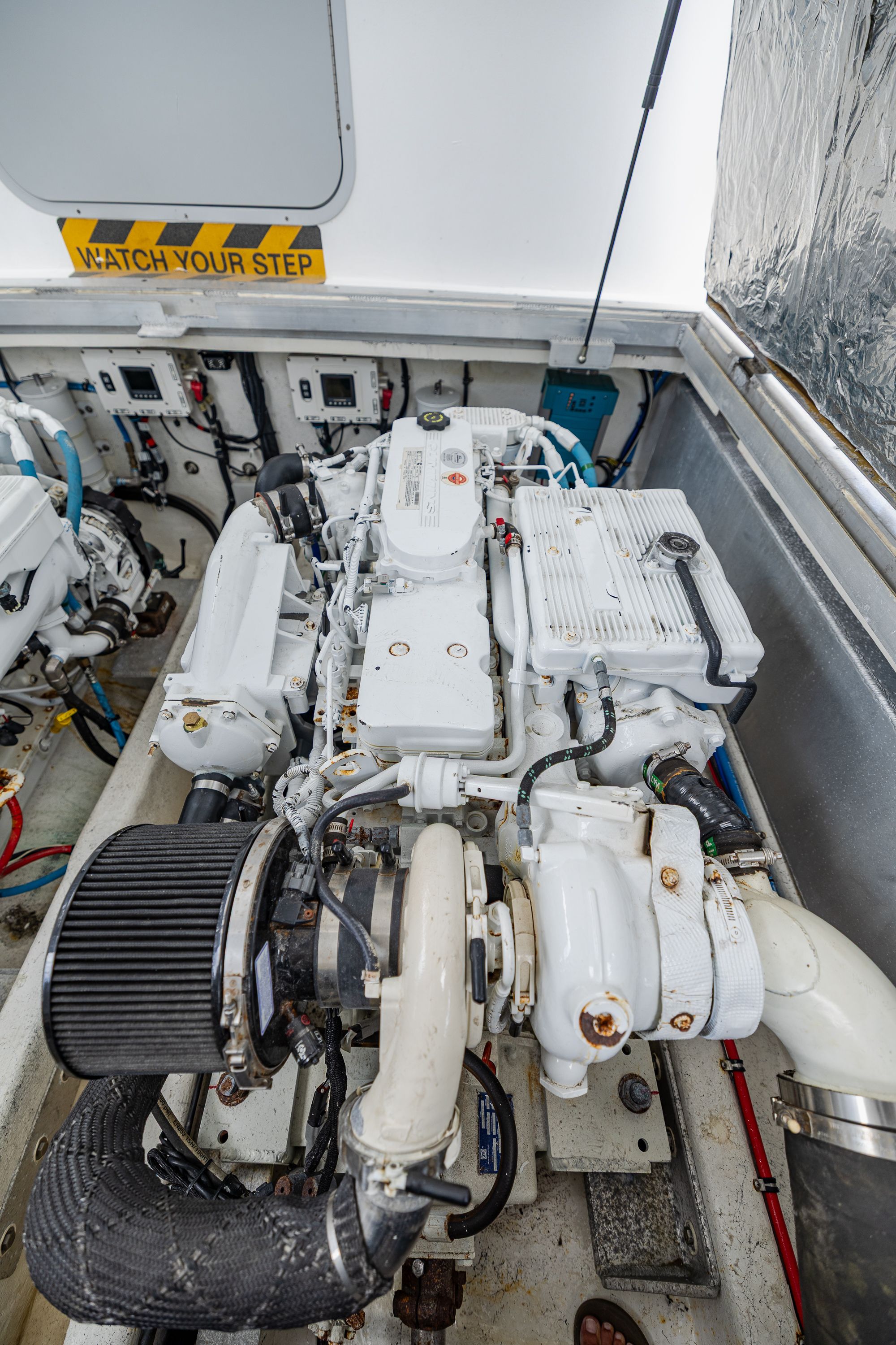 Engine room of a 2019 Newton 36' Dive Special boat with visible machinery.