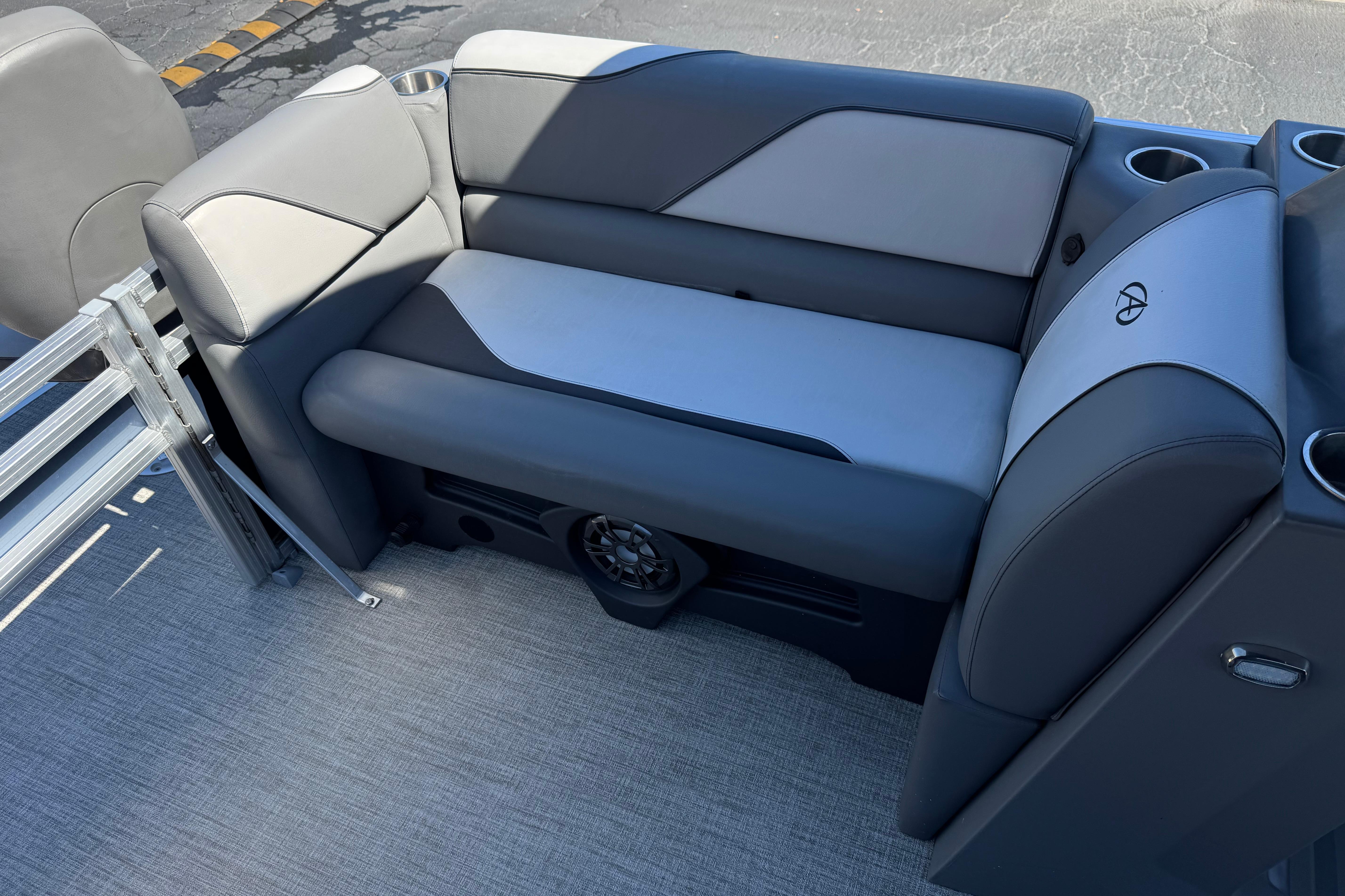 2023 Avalon Venture Fish N Cruise boat seating with cup holders and speaker.