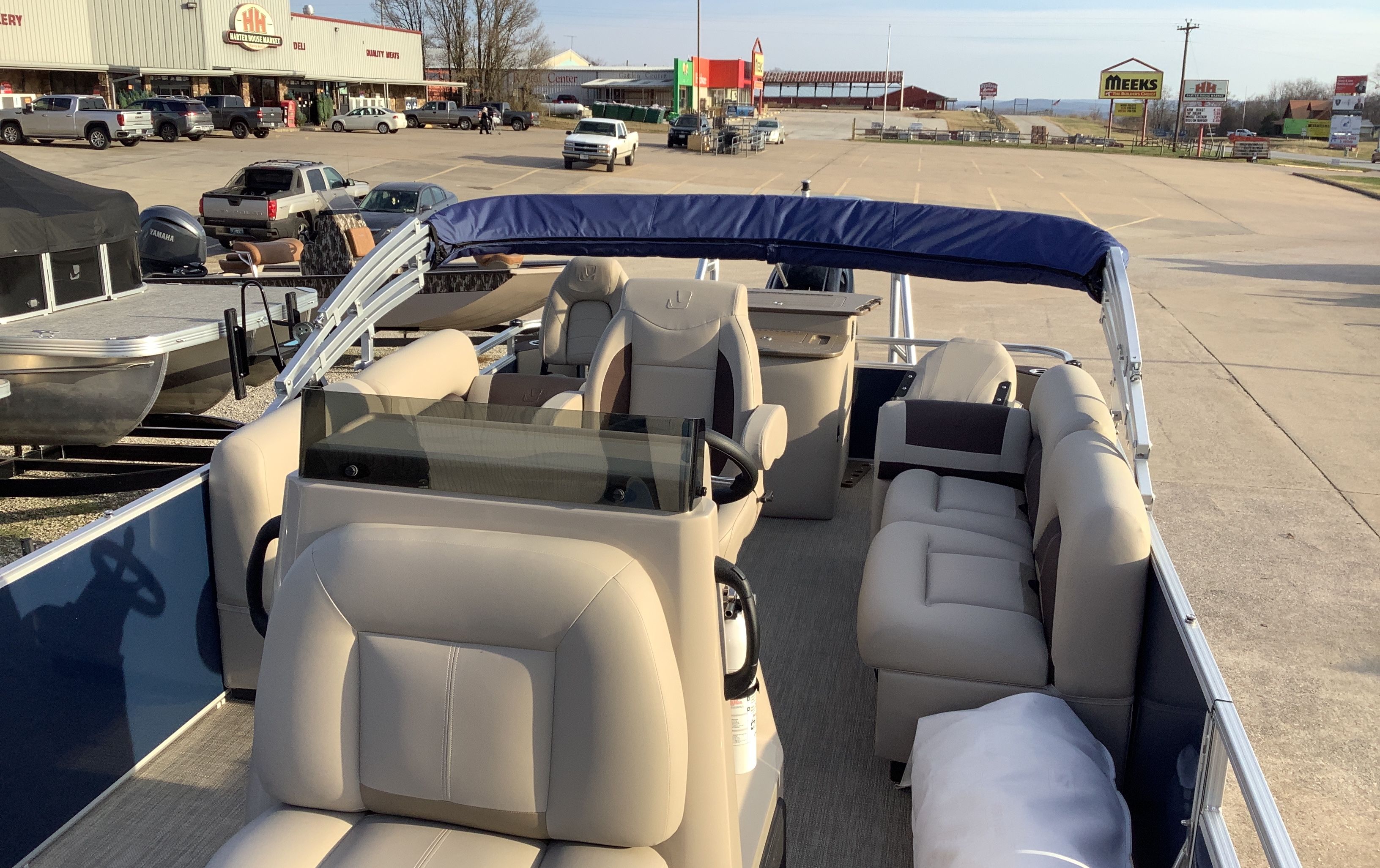 Interior of 2026 Landau Alure 23CC Fish with comfortable seating.