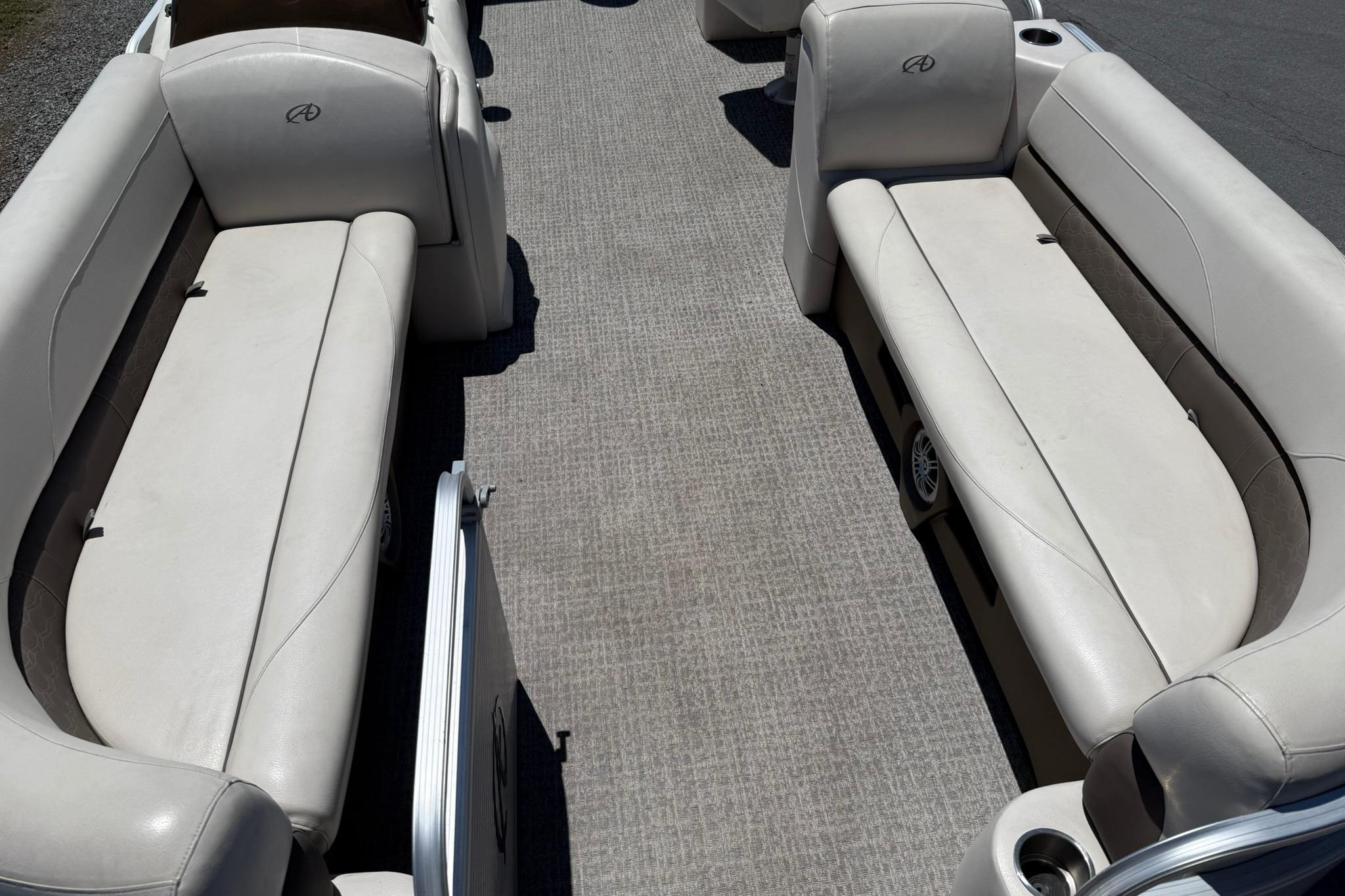 2019 Avalon GS Quad Lounge 25' interior with spacious seating and carpeted flooring.