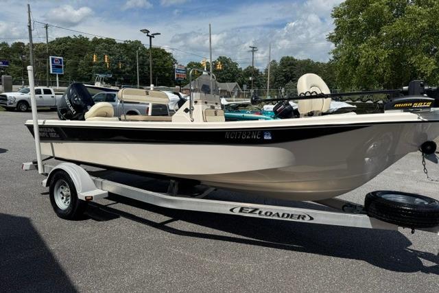 2023 Carolina Skiff 192 JLS boat on EZ Loader trailer in parking lot.
