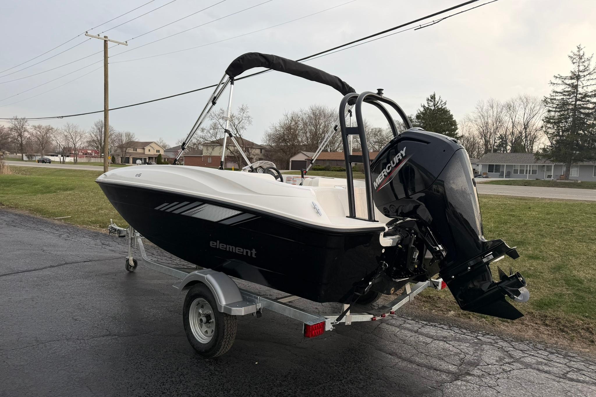 2026 Bayliner Element E16 boat on trailer with Mercury outboard motor.