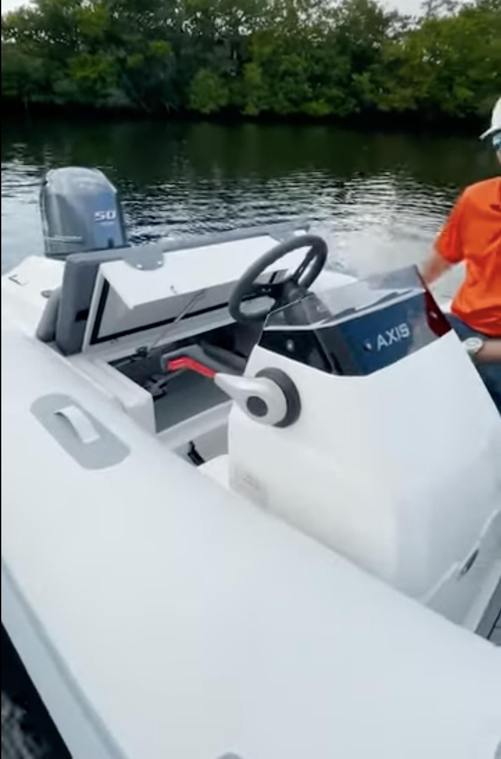 2023 Northstar Axis 3.8 boat on water, featuring sleek design and modern controls.
