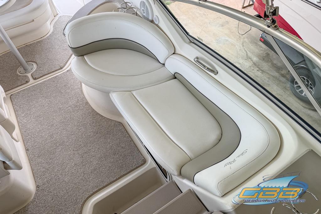 Interior seating of 2006 Sea Ray Sundancer 260 boat, featuring plush white upholstery.