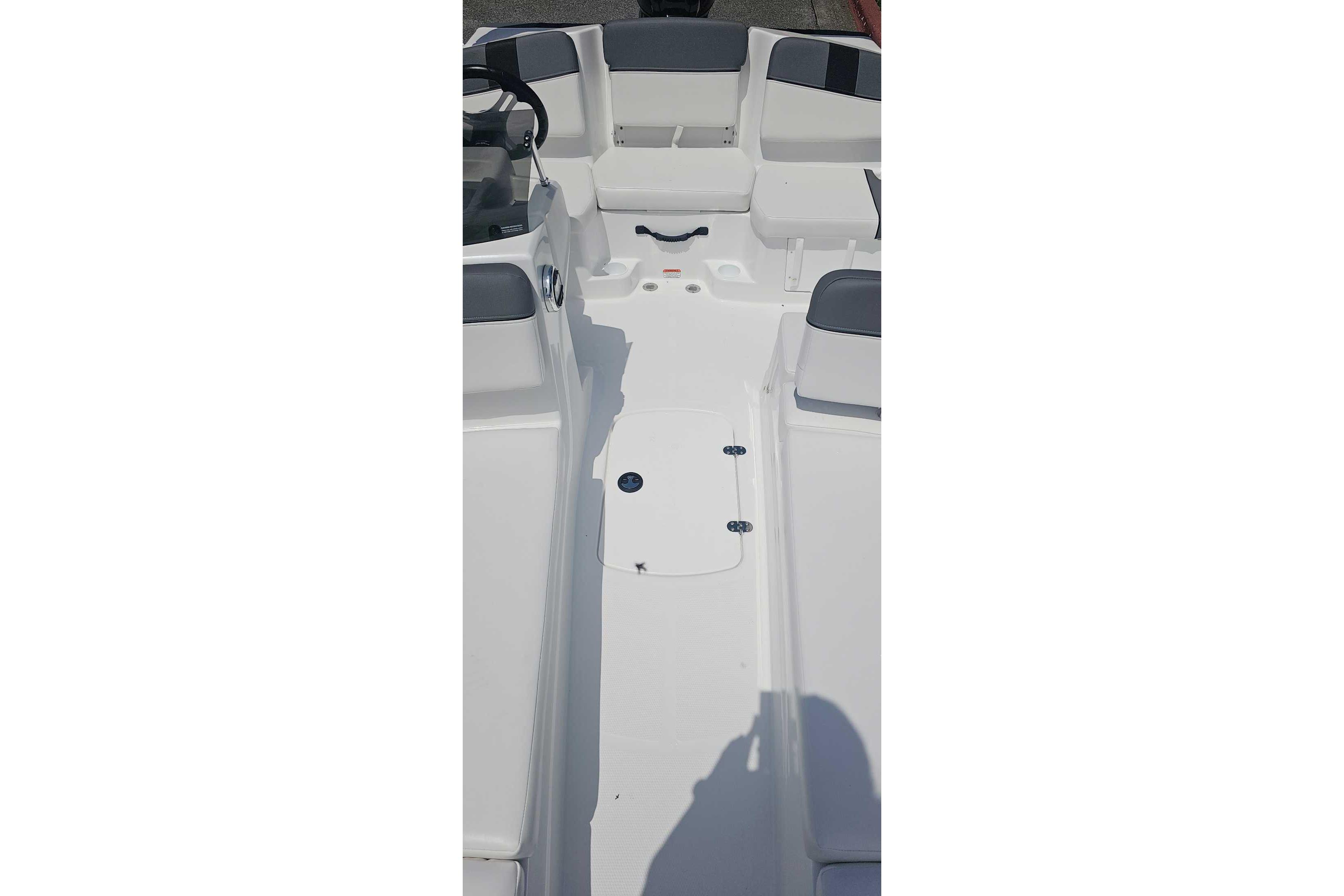 2026 Tahoe T16 boat interior with white seating and steering wheel.