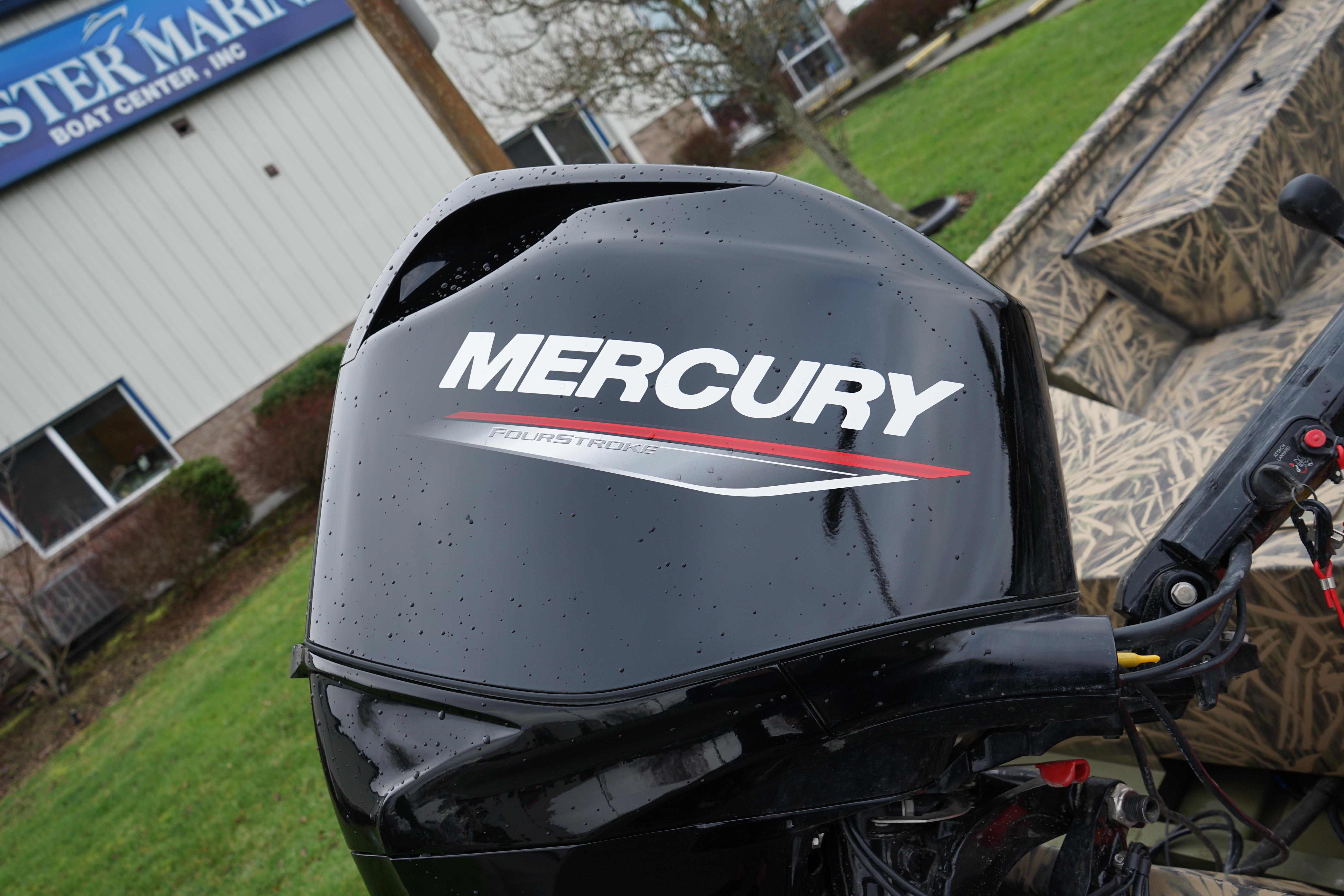 2024 Lund 1760 Predator Tiller with Mercury FourStroke engine at a boat center.