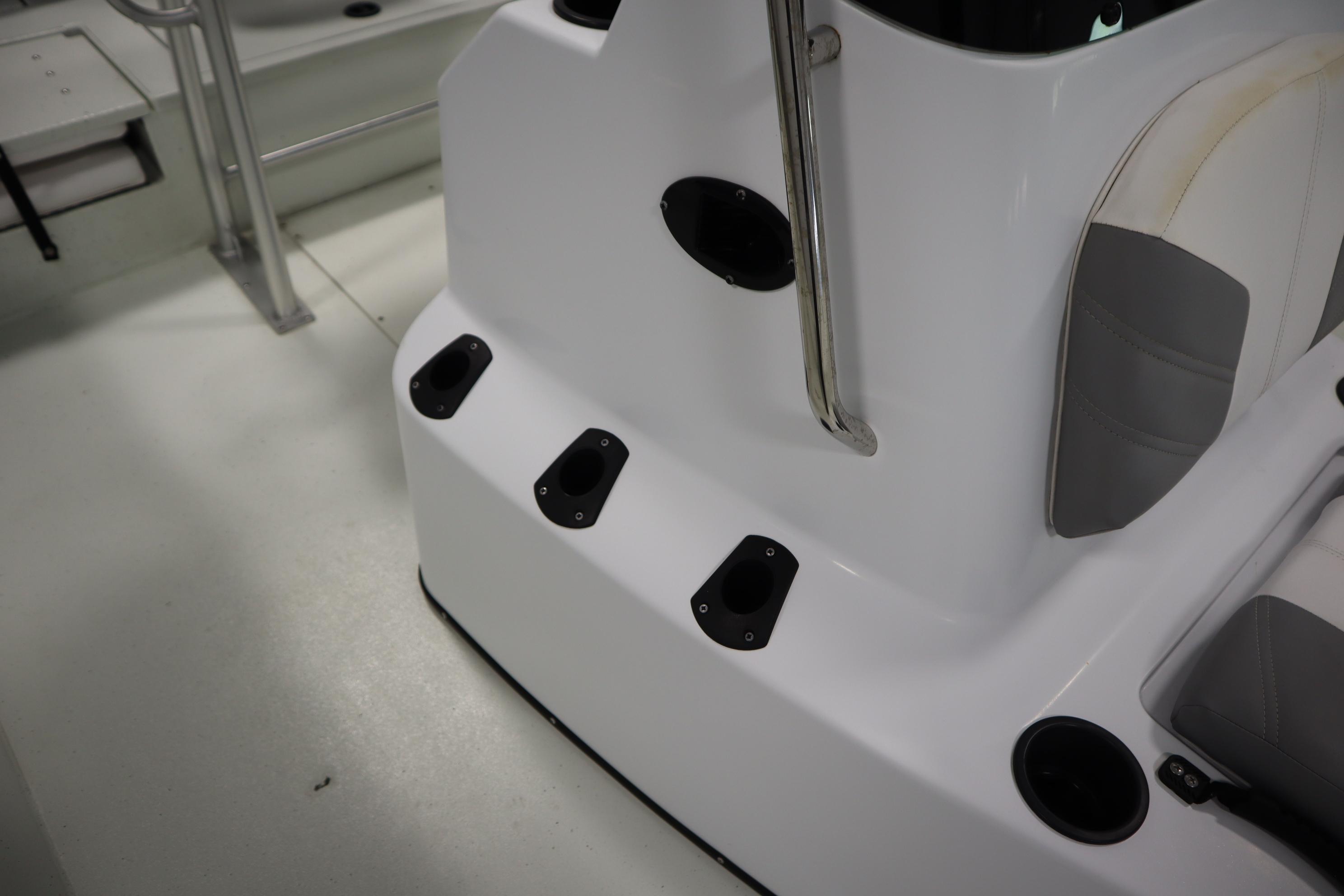 2022 Crestliner 2200 CC boat interior with rod holders and seating.