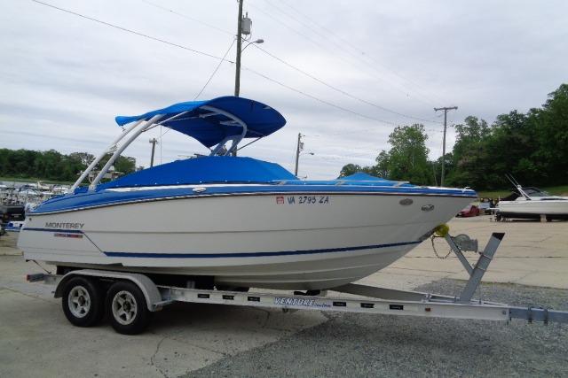 2019 Monterey 218SS Super Sport boat on trailer with blue cover and canopy.