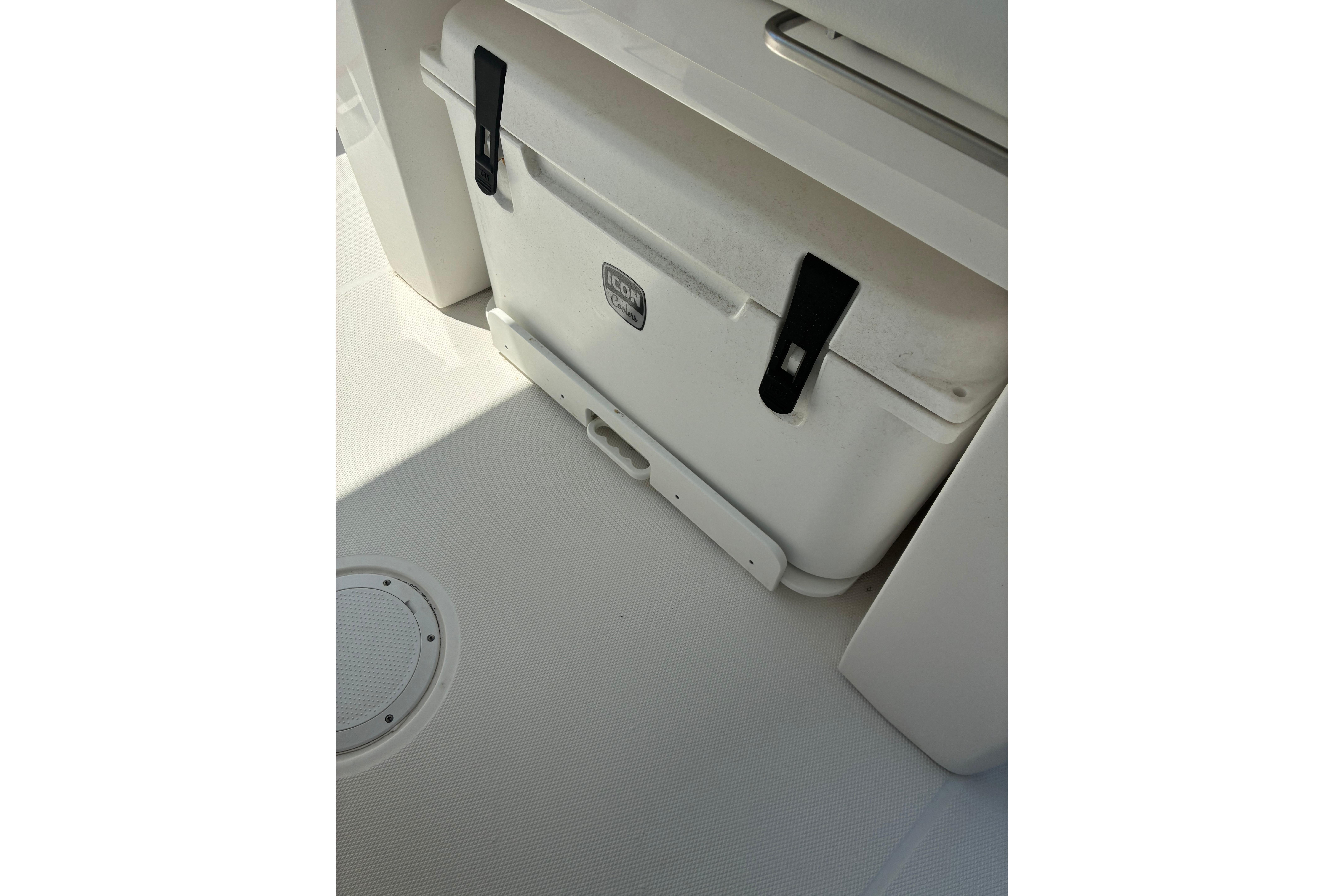 2023 Edgewater 285CC boat interior with built-in cooler storage.