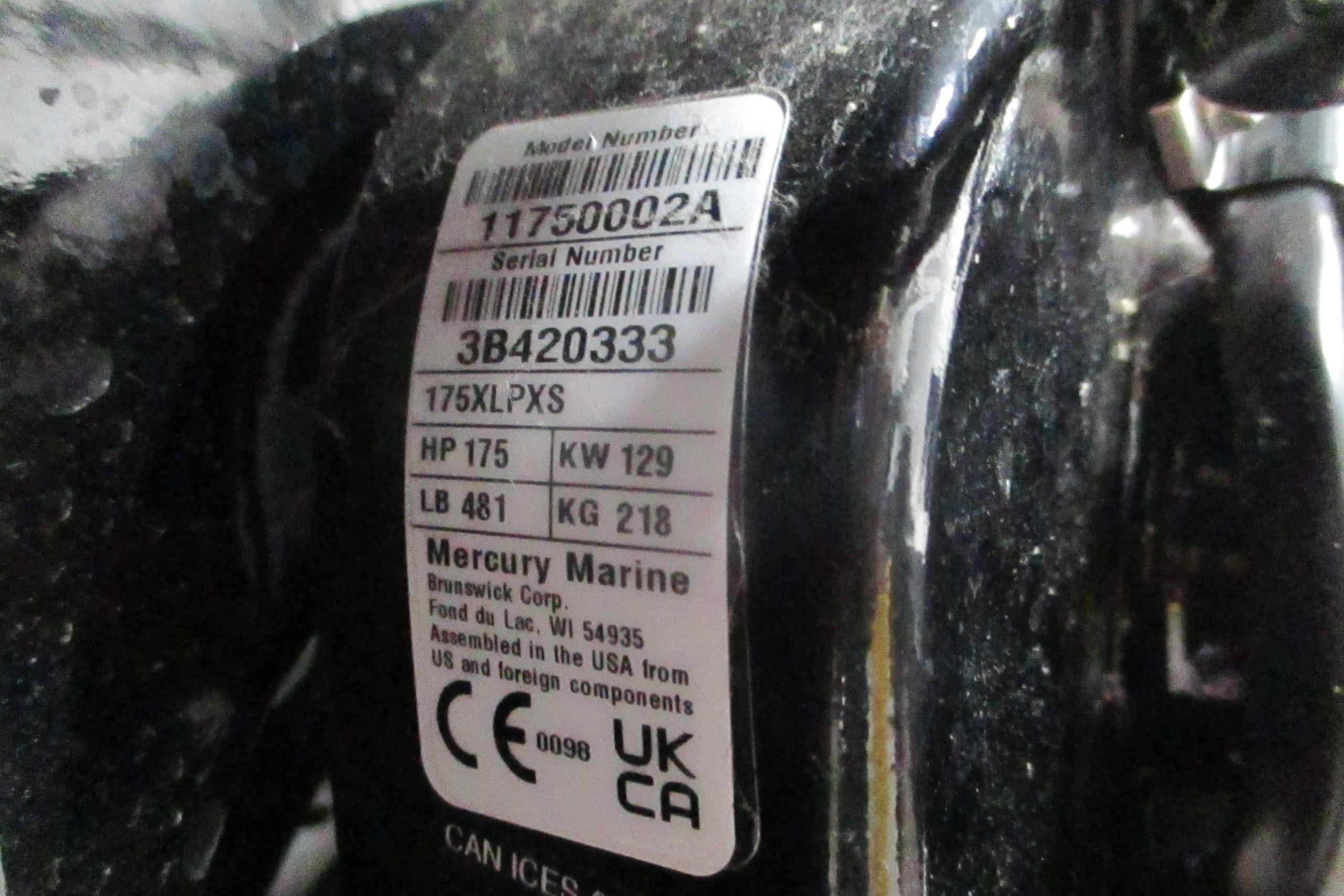 Label on Mercury Marine engine with model and serial numbers, specifications, and compliance marks.