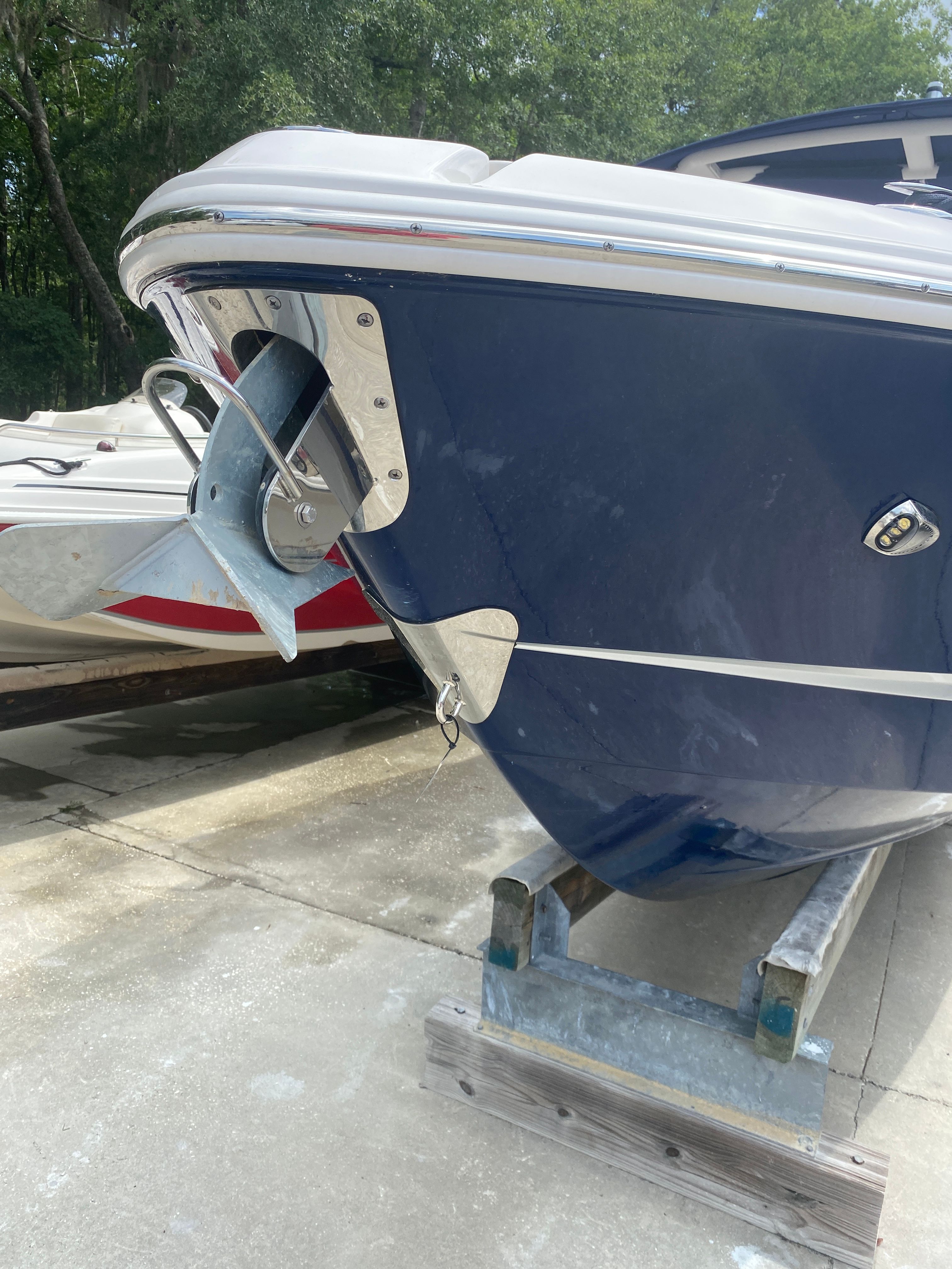 2020 Chaparral 256 SSX boat with anchor on stand.