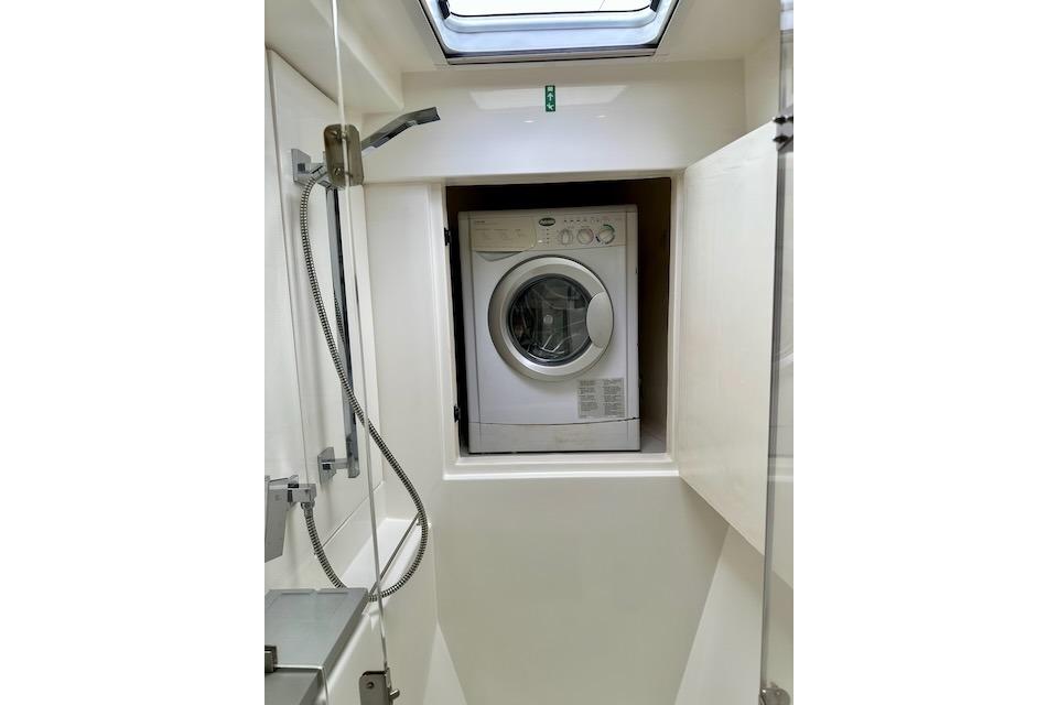 Compact washing machine in a 2017 Leopard 40 yacht bathroom.