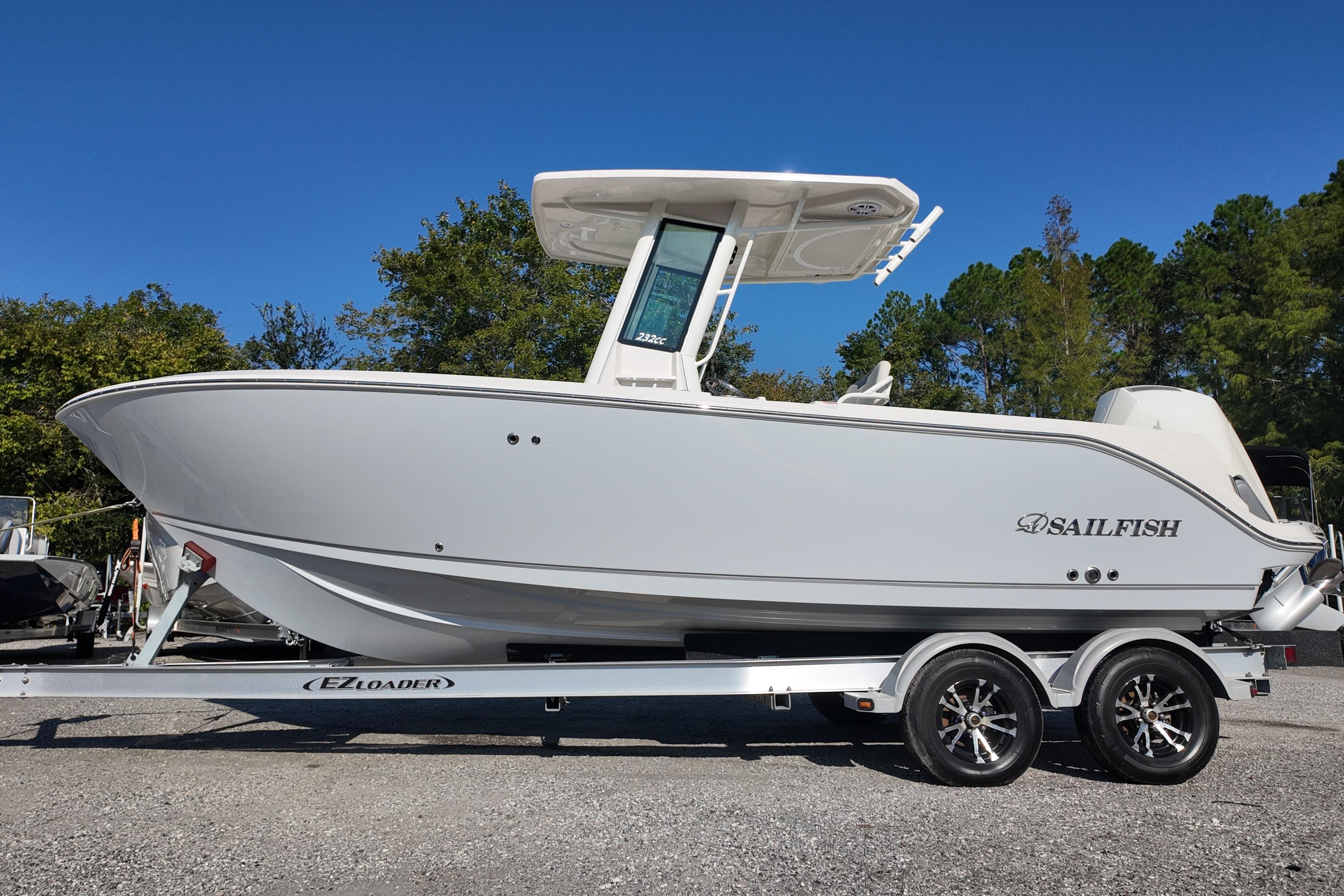 2026 Sailfish 232 CC boat on trailer, parked outdoors, side view.
