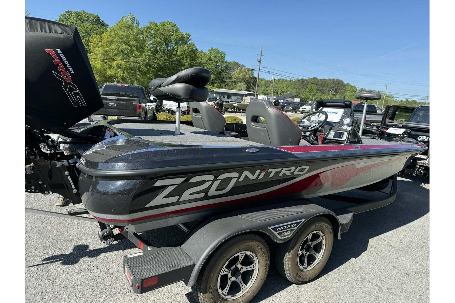 2023 Nitro Z20 Pro bass boat with Mercury Pro XS engine, parked outdoors.