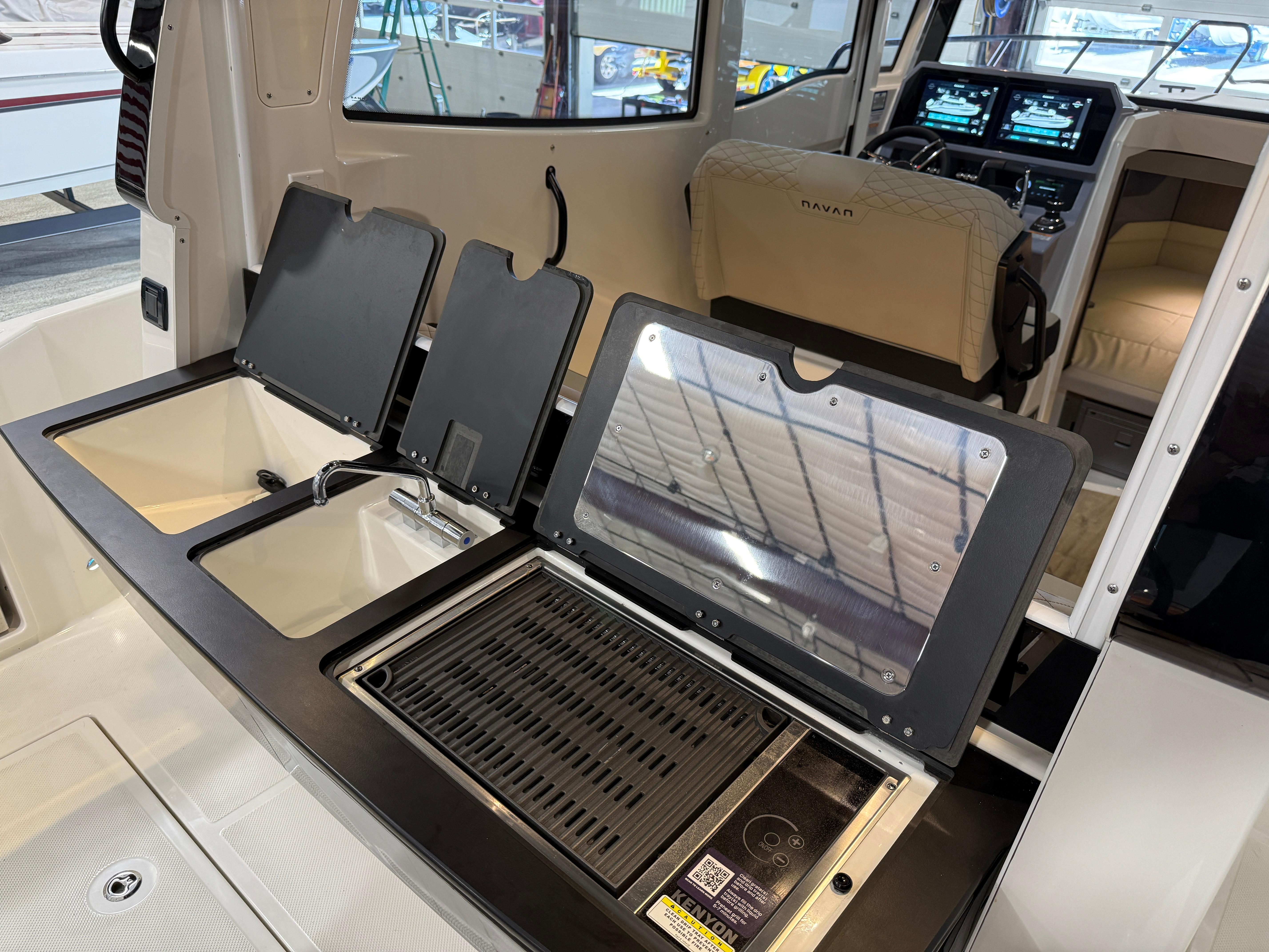 Navan C30 2025 boat interior with modern kitchen and navigation controls.